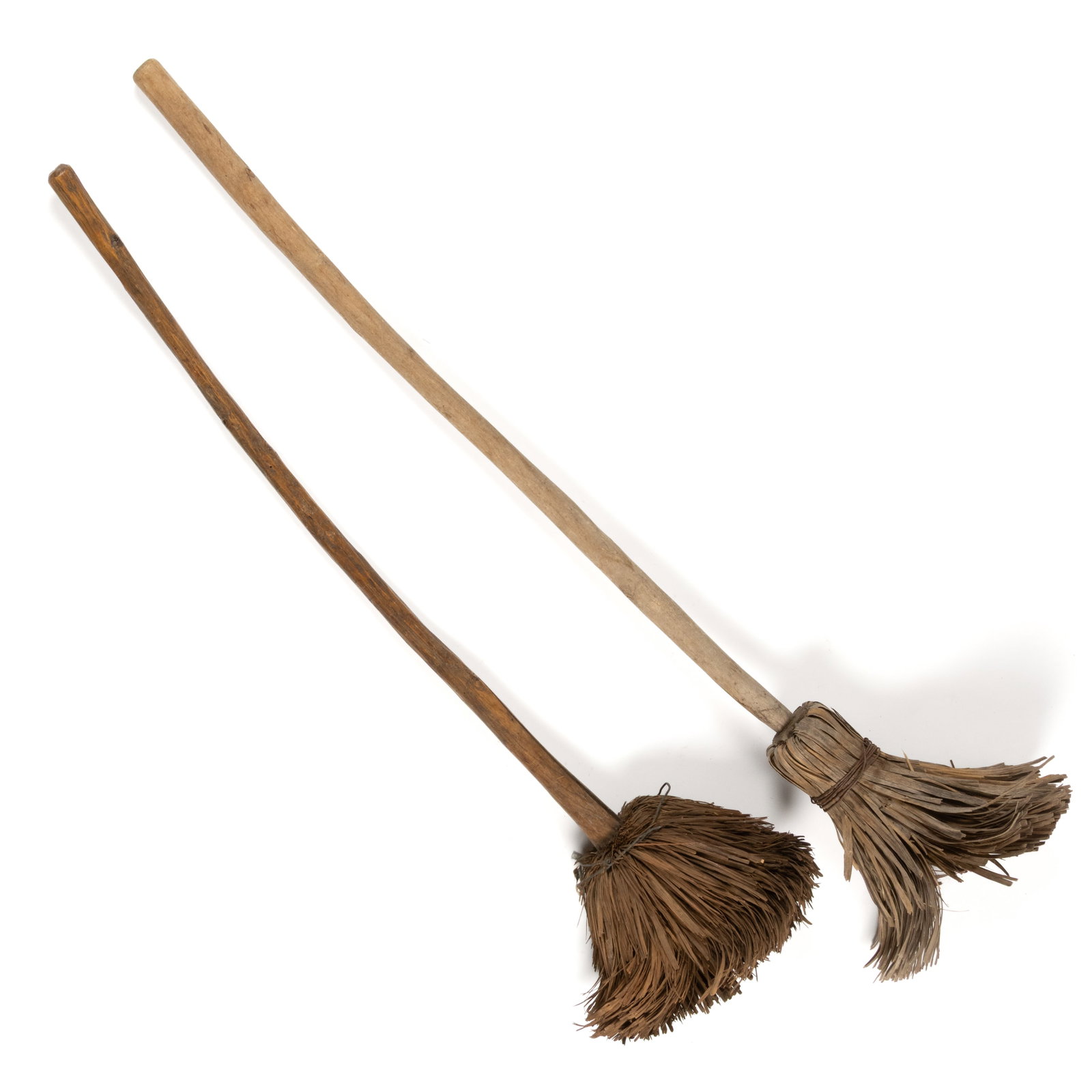 AMERICAN HICKORY AND ASH / BIRCH SHAVED / SPLINT HEARTH BROOMS, LOT OF TWO: AMERICAN HICKORY AND ASH / BIRCH SHAVED / SPLINT HEARTH BROOMS, LOT OF TWO, each having a shaven handle with splints bent down and secured by wire, each retains the original dry surface. Late 19t