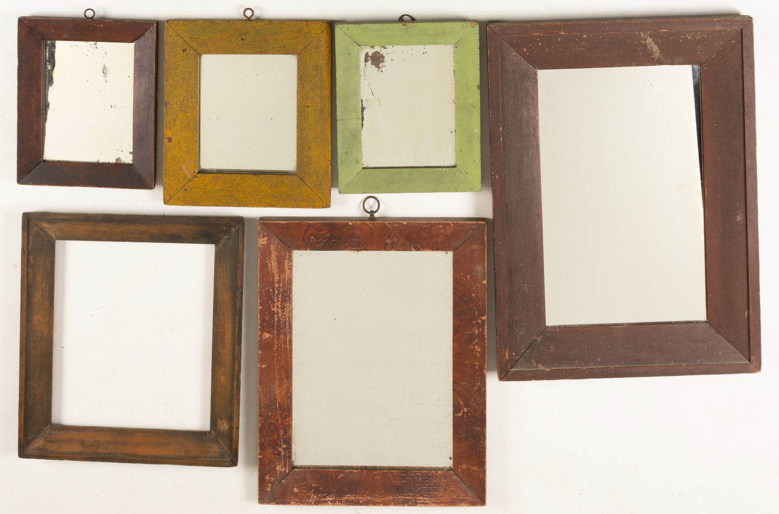 ASSORTED PAINTED WOODEN AND STAINED MIRRORS AND FRAME, LOT OF SIX: ASSORTED PAINTED WOODEN AND STAINED MIRRORS AND FRAME, LOT OF SIX, each of rectangular form, comprising five examples with a mirror, painted surfaces include red, mustard yellow and green, one ex