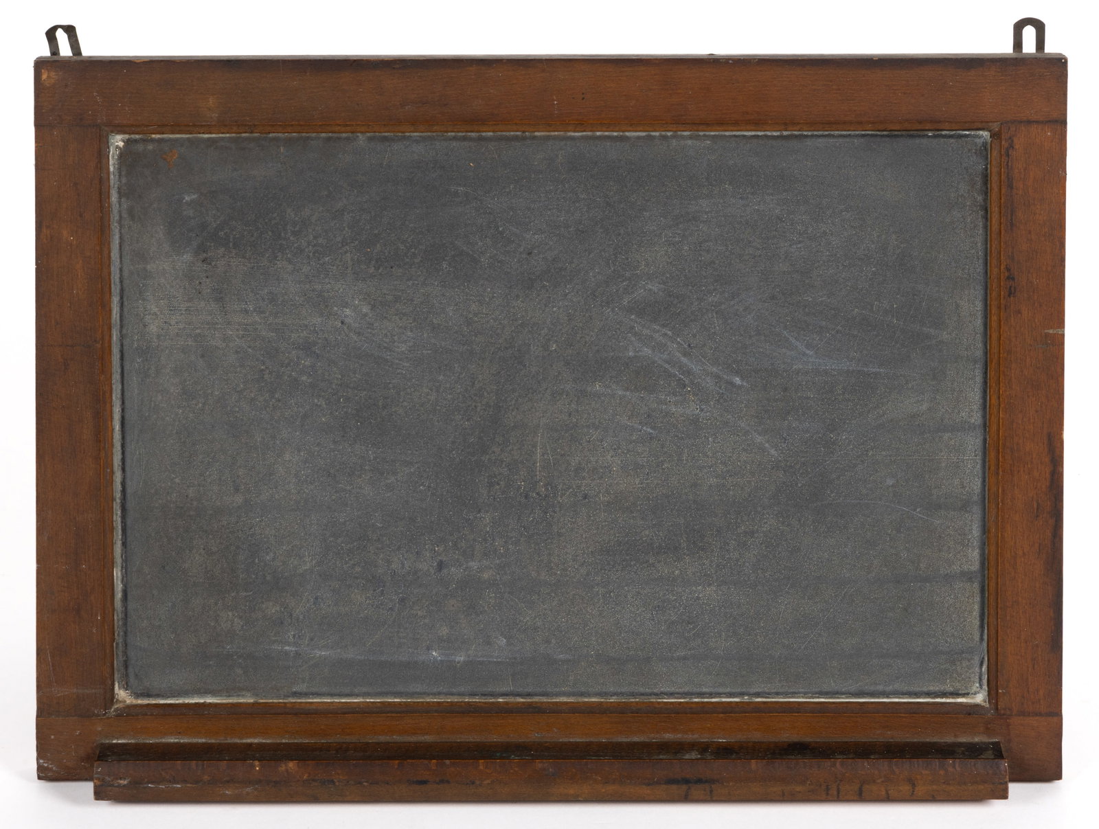 AMERICAN WALL-HANGING SCHOOL SLATE CHALKBOARD: AMERICAN WALL-HANGING SCHOOL SLATE CHALKBOARD, rectangular form with a molded maple frame and a chalk shelf along the bottom edge. Retains the likely original finished surface. Late 19th/early 20th