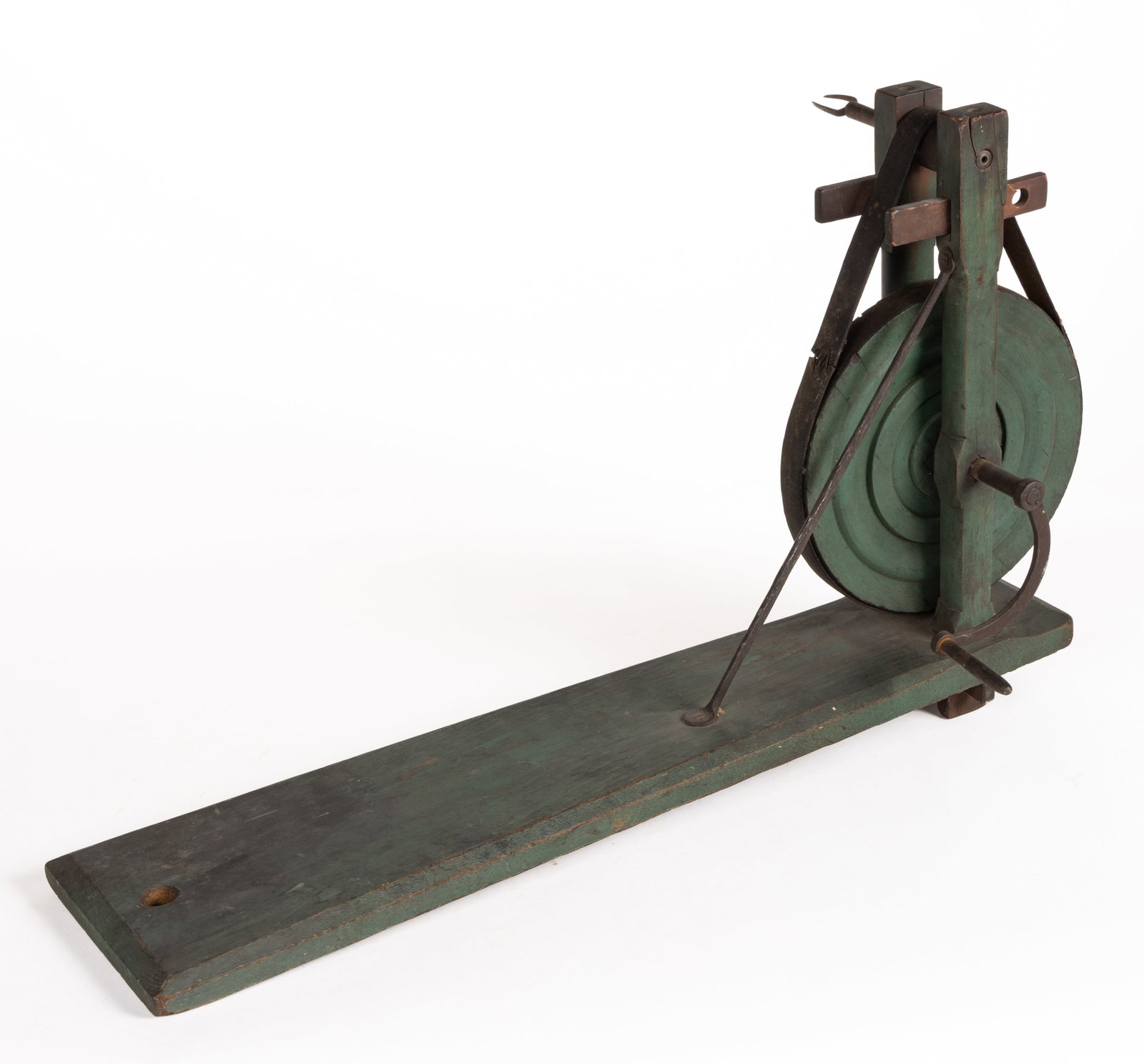 AMERICAN PAINTED TREEN APPLE PEELER: AMERICAN PAINTED TREEN APPLE PEELER, mixed woods including oak and probably maple, with a tapered platform base, two through-mortised posts supporting a wheel and the piece which holds the apple when 