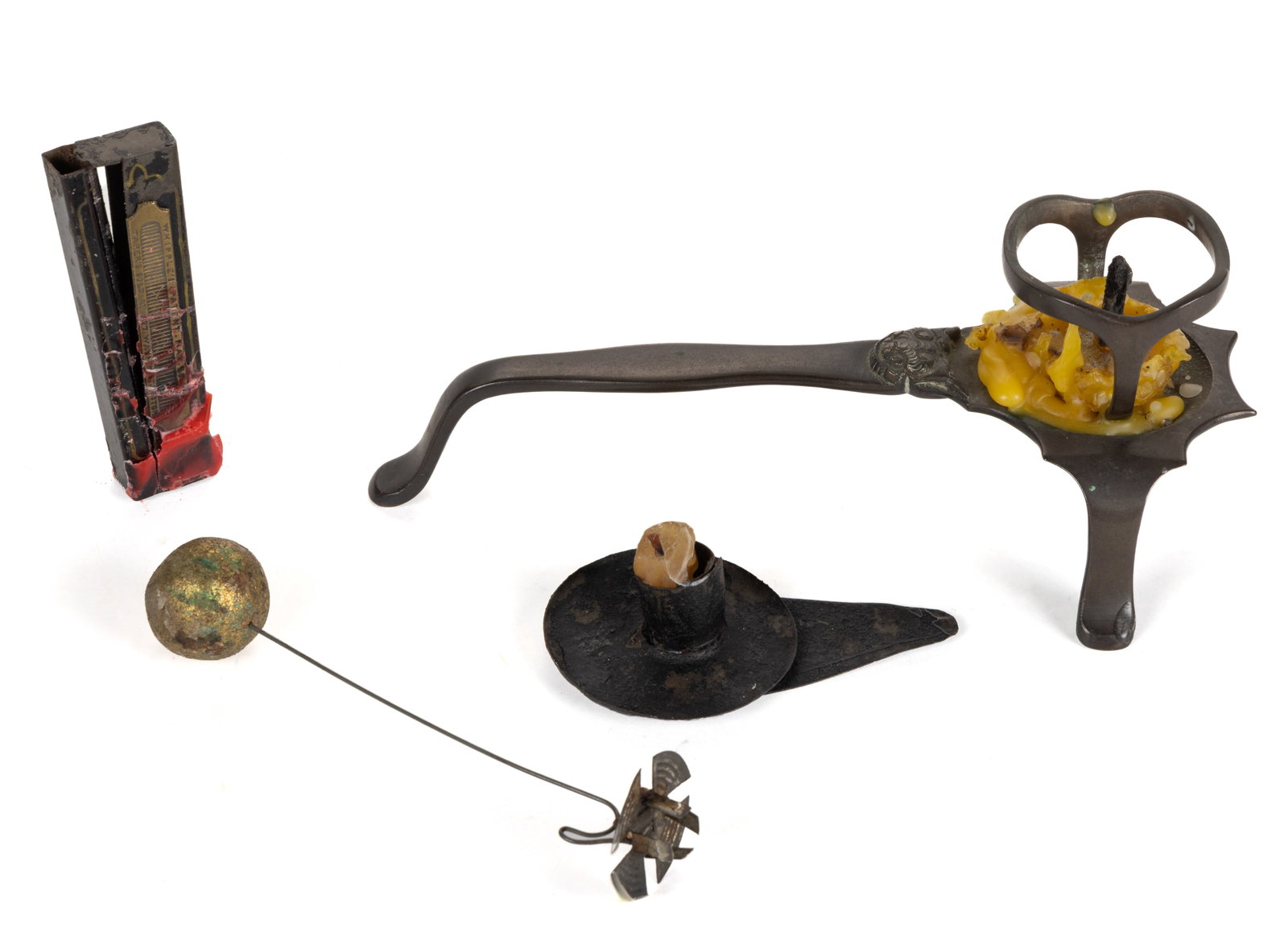 ASSORTED METAL CANDLE HOLDERS, LOT OF FOUR: ASSORTED METAL CANDLE HOLDERS, LOT OF FOUR, comprising of a bronze holder with ringed cage with central prick and raised on three legs with handle, having ornamentation at the shaft; a Christmas