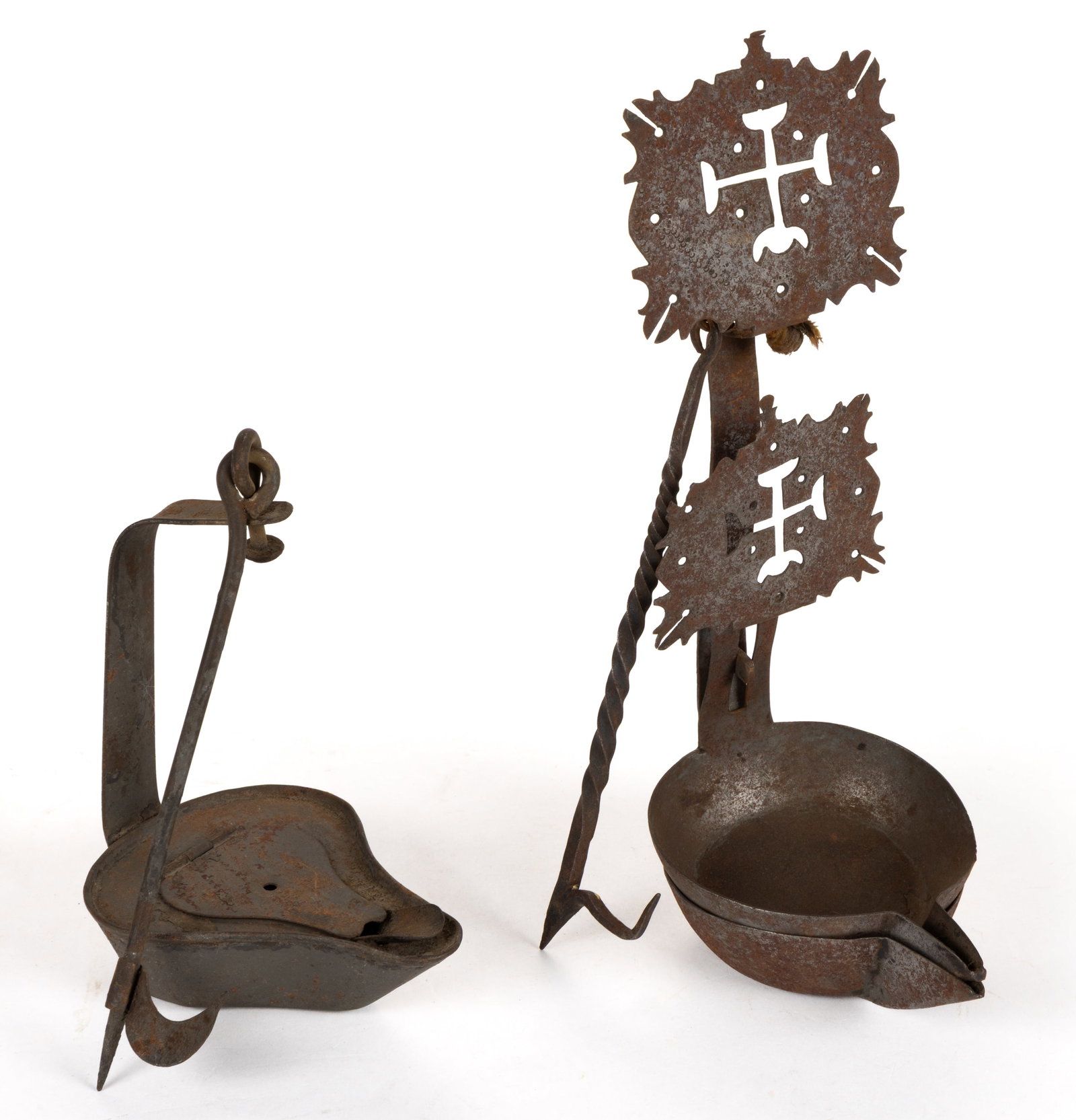 ASSORTED SHEET-IRON BETTY LAMP / CRUSIES, LOT OF TWO: ASSORTED SHEET-IRON BETTY LAMP / CRUSIES, LOT OF TWO, comprising of a betty lamp with hinged cover and hook; and a Continental double crusie, having a finely cut edge and ornamentation hanger, fitted
