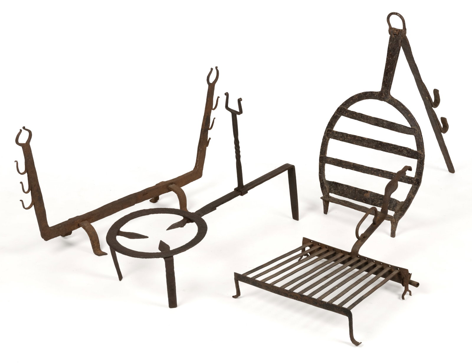 WROUGHT-IRON HEARTH / FIREPLACE ARTICLES, LOT OF FOUR: WROUGHT-IRON HEARTH / FIREPLACE ARTICLES, LOT OF FOUR, comprising of a trivet having a circular plate with central pointed supports and raised on three tall legs, one leg extension connected to t