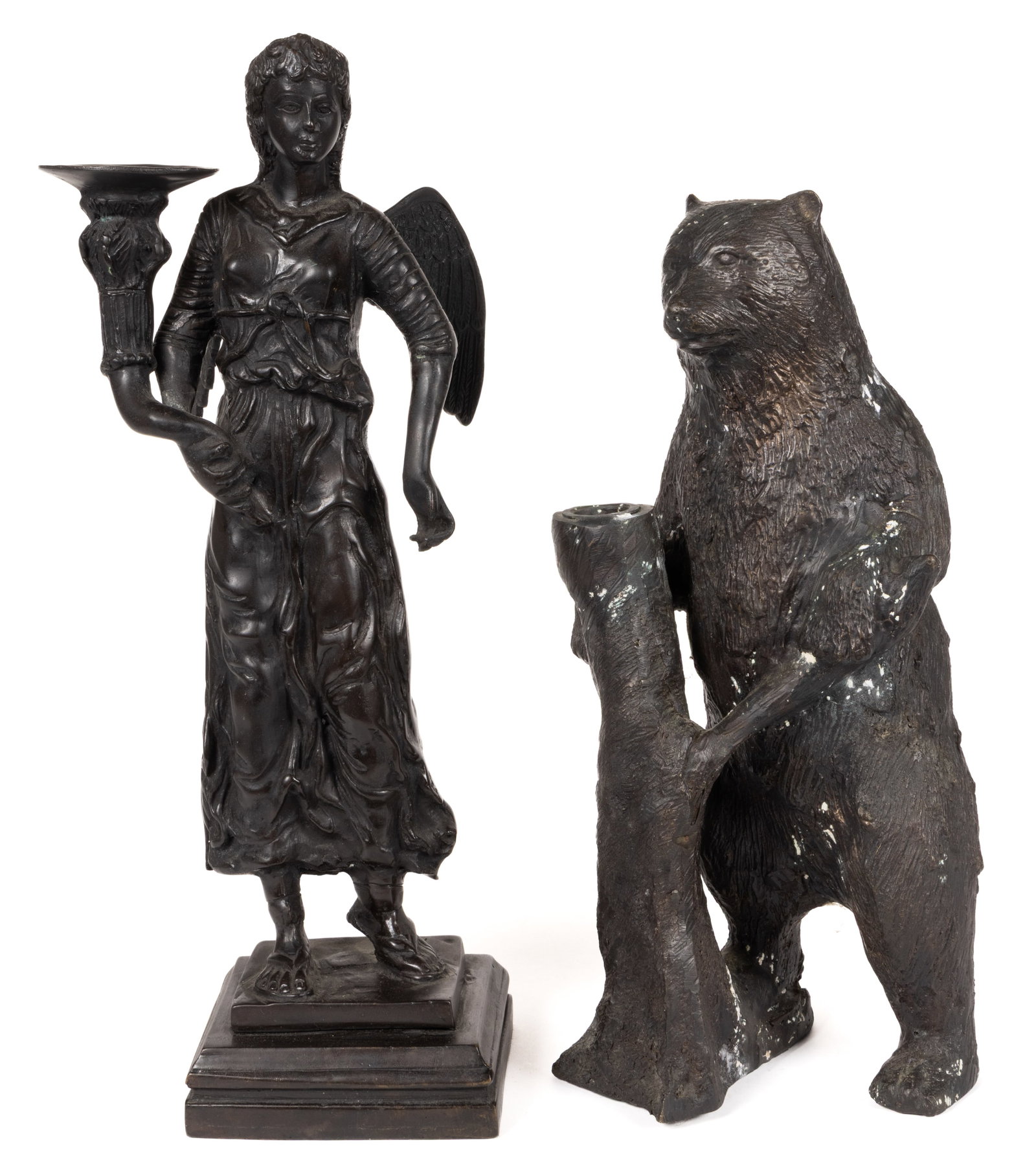 CAST-BRONZE FIGURAL CANDLE HOLDERS, LOT OF TWO: CAST-BRONZE FIGURAL CANDLE HOLDERS, LOT OF TWO, each of hollow cast form, the larger depicting a full-body angel standing on a stepped base, the shorter depicting a bear standing next to a log on its 