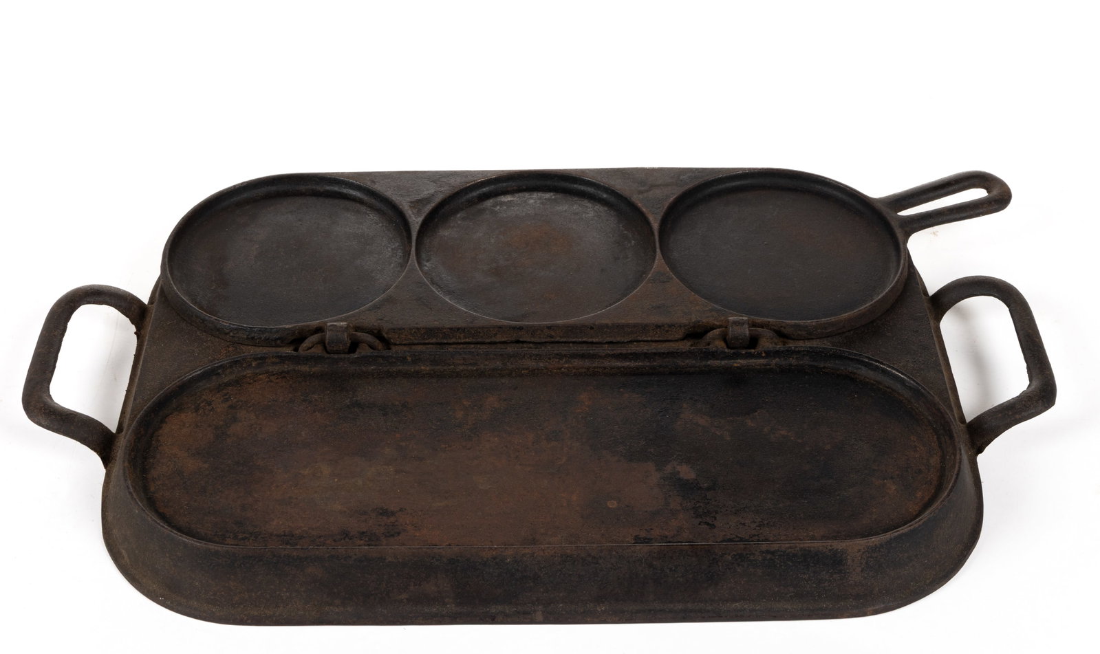 STUART PETERSON & CO. CAST-IRON COMBINATION FLIP-TOP PANCAKE GRIDDLE: STUART PETERSON & CO. CAST-IRON COMBINATION FLIP-TOP PANCAKE GRIDDLE, hinged three-section pancake mold with embossing to top of each circle, including "AGENTS / NEW YORK", "STUART 