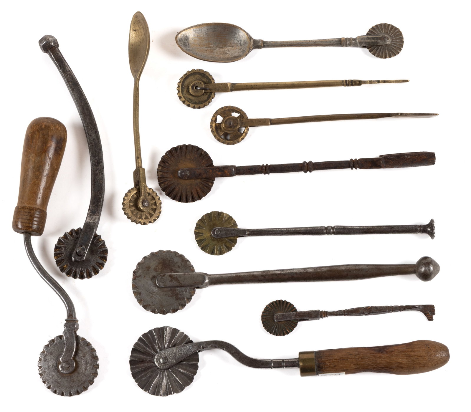 ASSORTED METALS PASTRY CRIMPERS / JAGGERS / JIGGERS, LOT OF 11: ASSORTED METALS PASTRY CRIMPERS / JAGGERS / JIGGERS, LOT OF 11, brass, wrought-iron and steel, comprising of six combination examples, including two with a spoon and two with a spatula, two examp