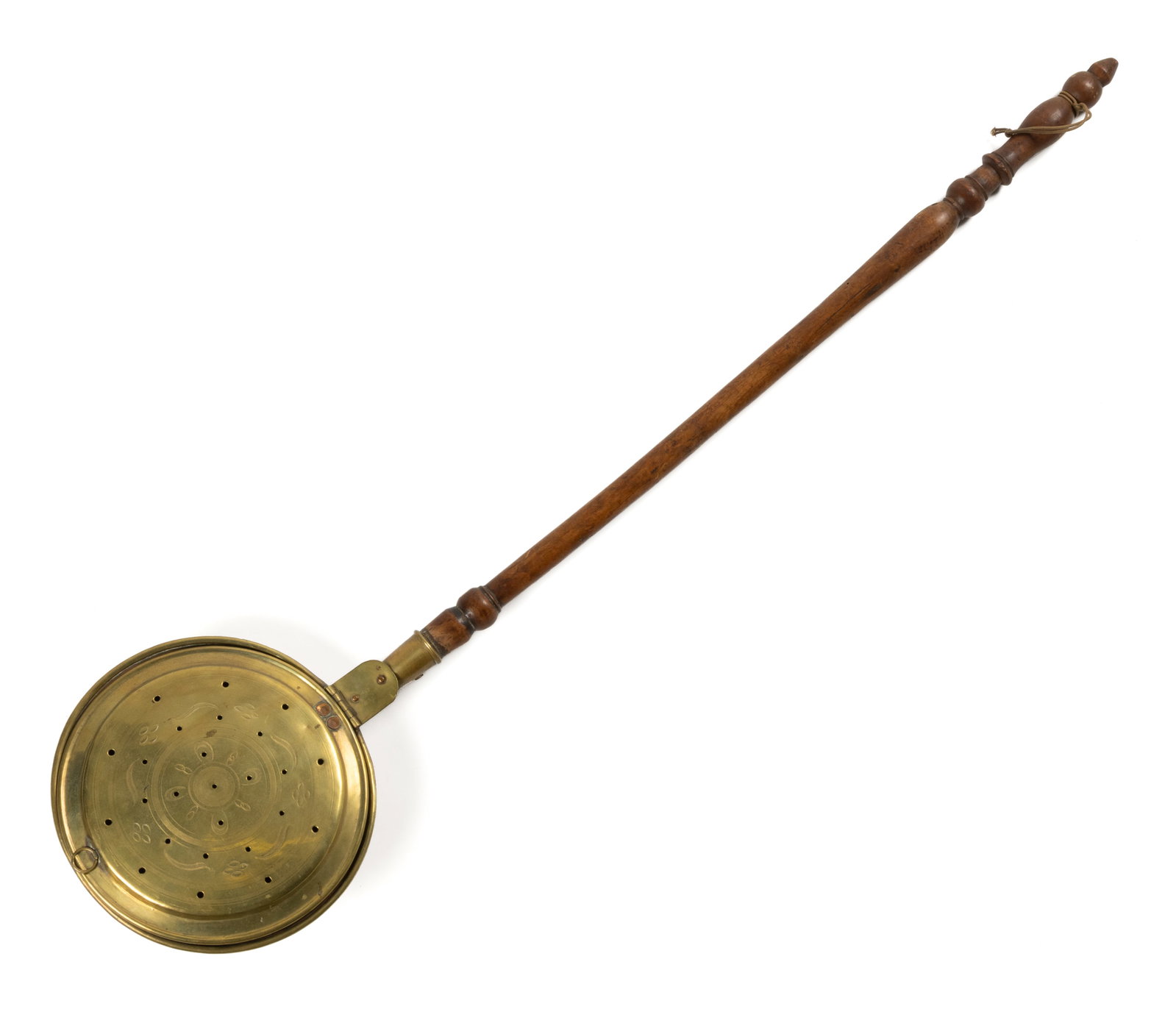 ENGLISH ENGRAVED BRASS BED WARMER: ENGLISH ENGRAVED BRASS BED WARMER, having a brass pan with engraved floral decoration within concentric circular reserves to lid on a long turned wooden handle. 19th century. 44" LOA, 1