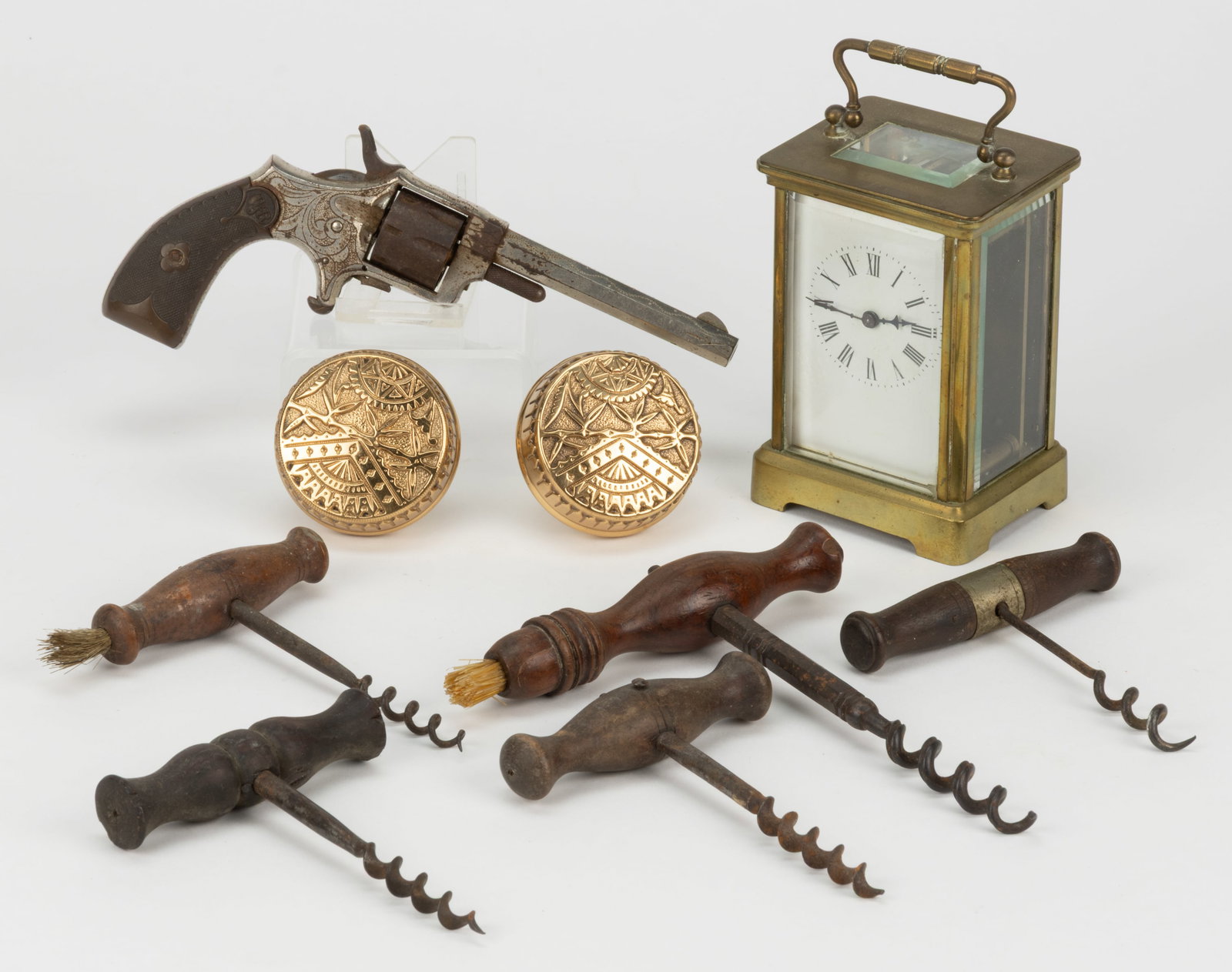 ASSORTED DOMESTIC AND DECORATIVE ACCESSORIES, LOT OF NINE: ASSORTED DOMESTIC AND DECORATIVE ACCESSORIES, LOT OF NINE, comprising five corkscrews, two of which have brushes; a pair of brass Aesthetic movement door knobs; a French carriage clock with winding ke