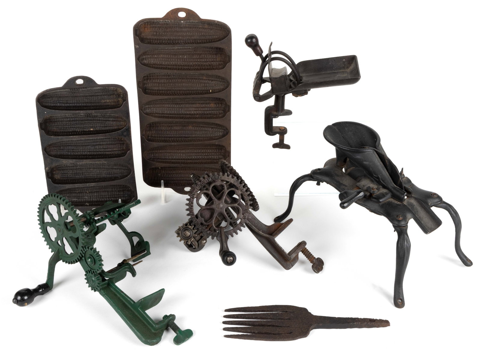 AMERICAN CAST-IRON AND WROUGHT-IRON DOMESTIC ACCESSORIES, LOT OF SEVEN: AMERICAN CAST-IRON AND WROUGHT-IRON DOMESTIC ACCESSORIES, LOT OF SEVEN, comprising two mechanical apple peelers, one marked for Sinclair R. Scott Co., Baltimore, the other for Goodell Co., Antrim, New
