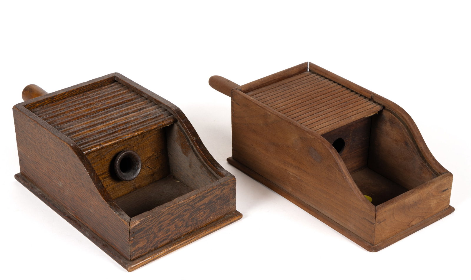 AMERICAN COUNTRY WOODEN BALLOT BOXES, LOT OF TWO: AMERICAN COUNTRY WOODEN BALLOT BOXES, LOT OF TWO, each box has two compartments with a central hole between them and a tambour sliding lid, each with an attached handle. Late 19th/early 20th century.