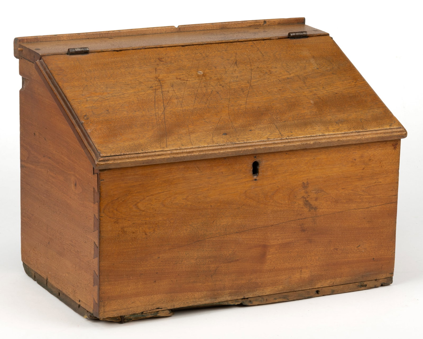 MID-ATLANTIC BUTTERNUT SLANT-TOP DOCUMENT BOX: MID-ATLANTIC BUTTERNUT SLANT-TOP DOCUMENT BOX, blind-dovetailed case with a nailed base, the narrow rectangular top with a short applied gallery over a hinged slanted lid with a molded edge concealing