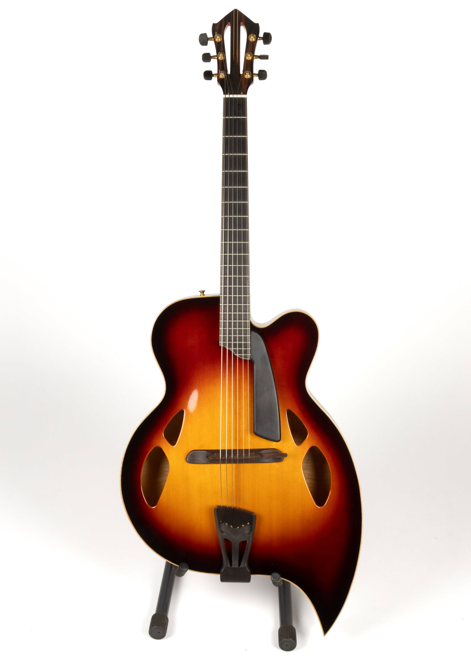 ARIA D'AQUISTO MODEL DQ-TD TEARDROP SUNBURST ARCHTOP ACOUSTIC GUITAR WITH ORIGINAL CASE: ARIA D'AQUISTO MODEL DQ-TD TEARDROP SUNBURST ARCHTOP ACOUSTIC GUITAR WITH ORIGINAL CASE, serial number G03011, six string, spruce top with four sound holes, raised ebony pickguard, "Accutone&