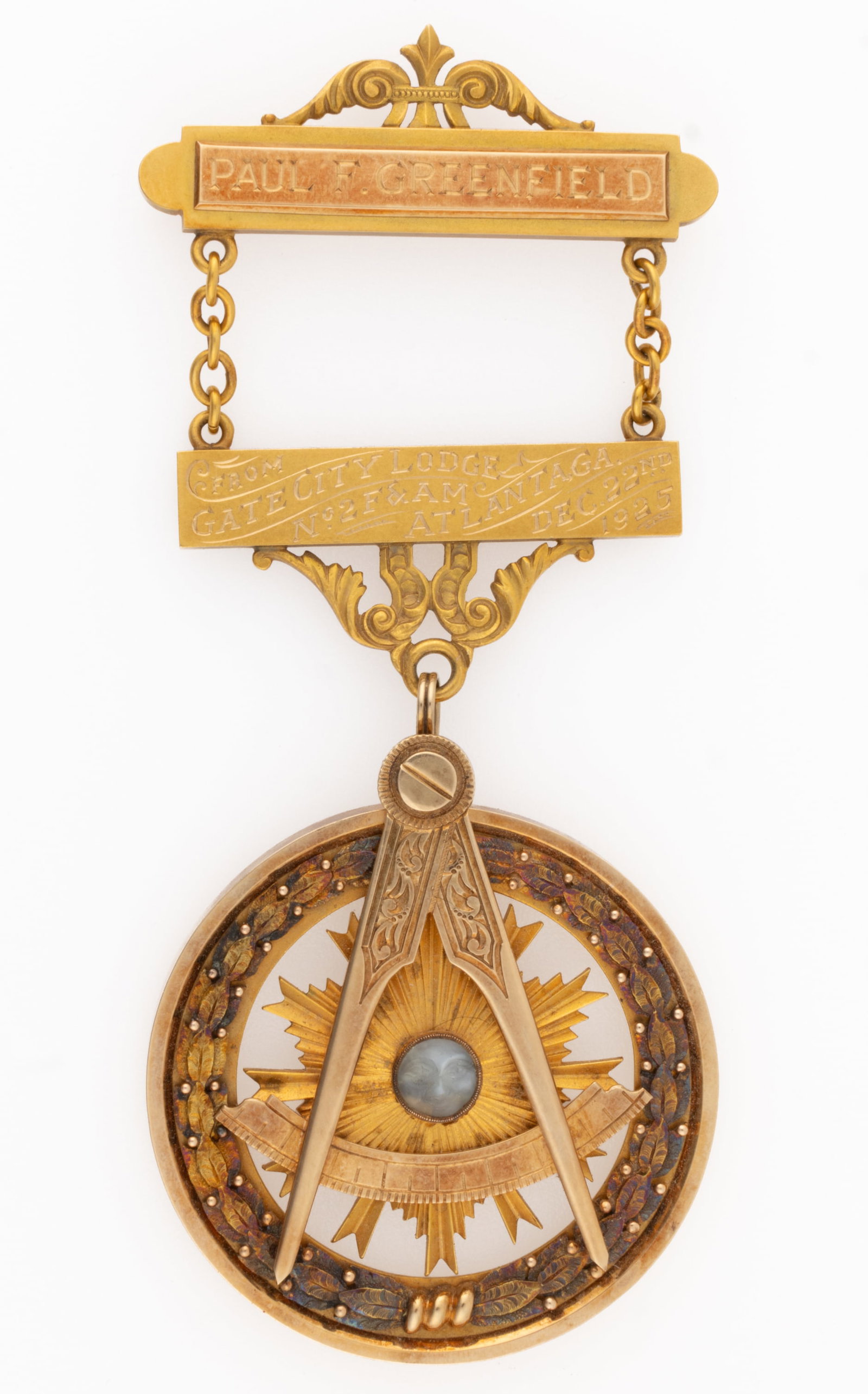 ANTIQUE 14K YELLOW GOLD AND CARVED STONE GEORGIA MASONIC JEWEL / PENDANT WITH GOLD-PLATED / -FILLED: ANTIQUE 14K YELLOW GOLD AND CARVED STONE GEORGIA MASONIC JEWEL / PENDANT WITH GOLD-PLATED / -FILLED NAME PLATE, jewel / pendant round form with partially open center having laurel wreath around the fr