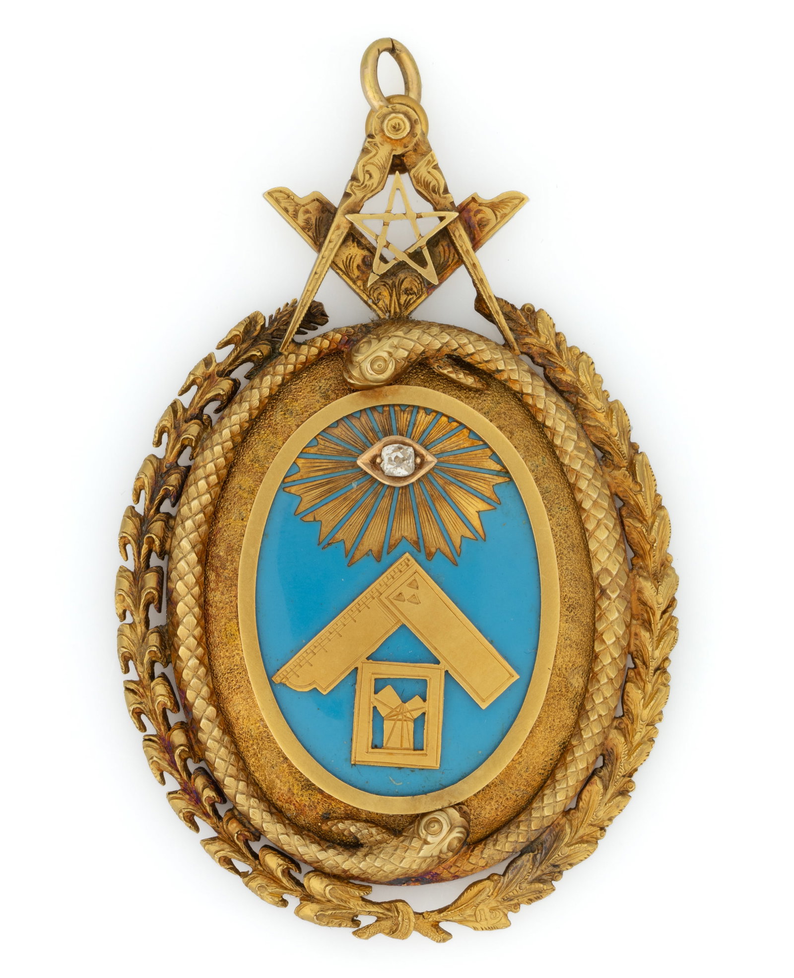 ANTIQUE 15K YELLOW GOLD, ENAMEL, AND DIAMOND MASONIC PENDANT: ANTIQUE 15K YELLOW GOLD, ENAMEL, AND DIAMOND MASONIC PENDANT, oval form, center featuring an applied All Seeing Eye set with an old mine-cut, or other cut, diamond that measures approximately 2.5 x 2.
