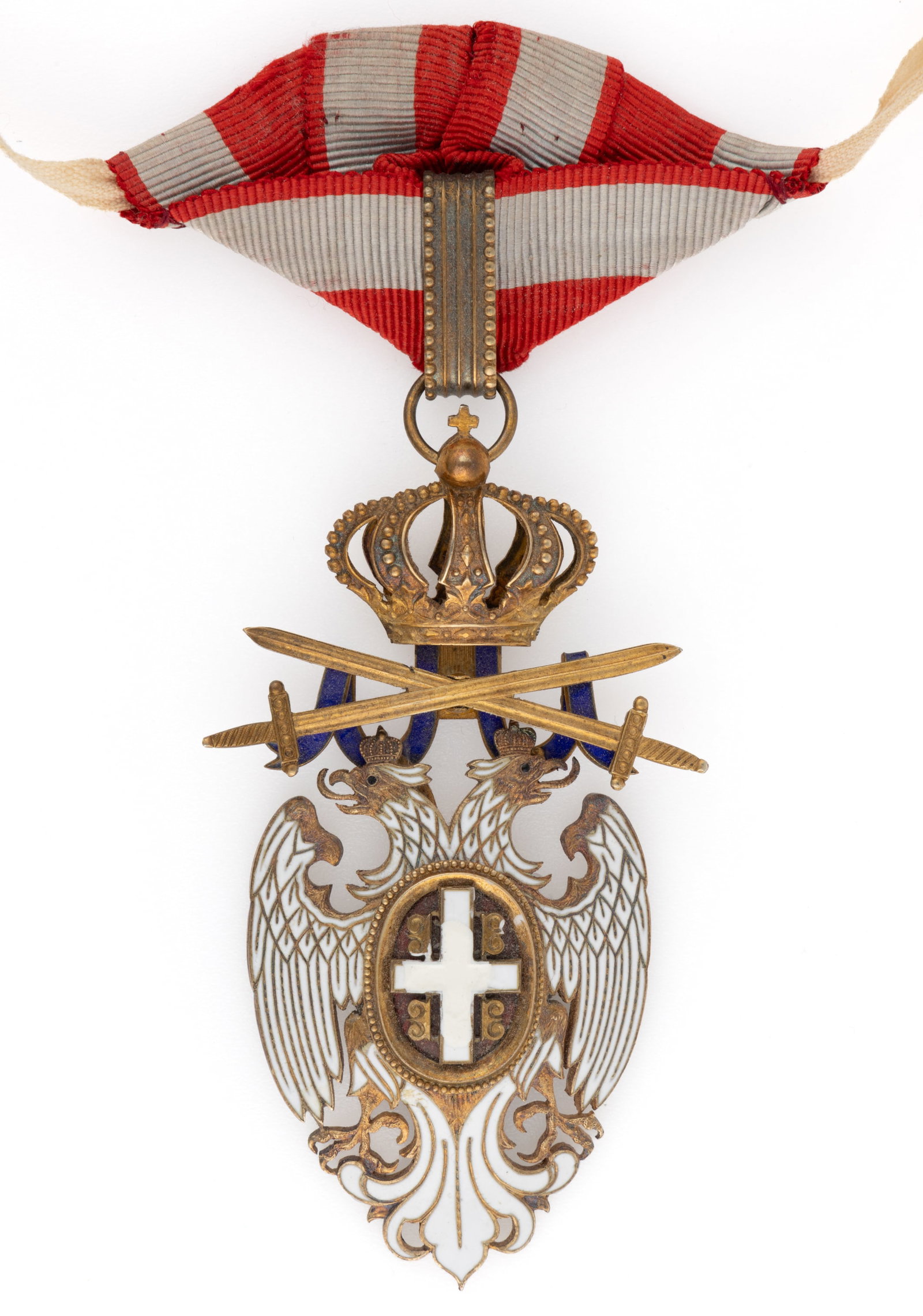 SERBIA "ORDER OF THE WHITE EAGLE" BADGE: SERBIA "ORDER OF THE WHITE EAGLE" BADGE, enamel and silver-gilt of unknown fineness, probably III Class Commander, depicting a white double-headed eagle with a shield-like ovate plate with c