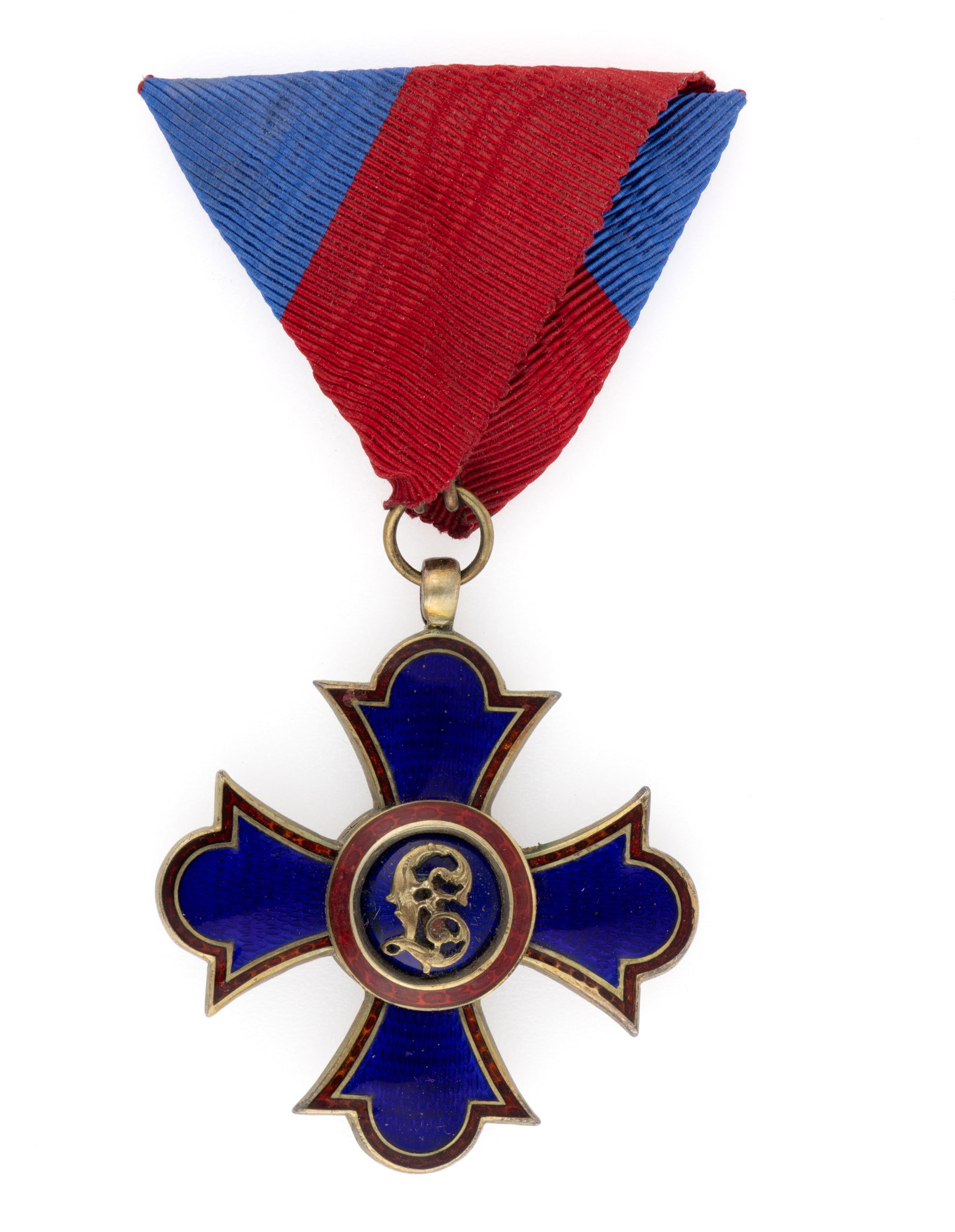 LIECHTENSTEIN "ORDER OF MERIT" CROSS BADGE: LIECHTENSTEIN "ORDER OF MERIT" CROSS BADGE, enamel and silver-gilt of unknown fineness, the central reserve having a monogram/cypher on each side. Retains the likely original ribbon and the 