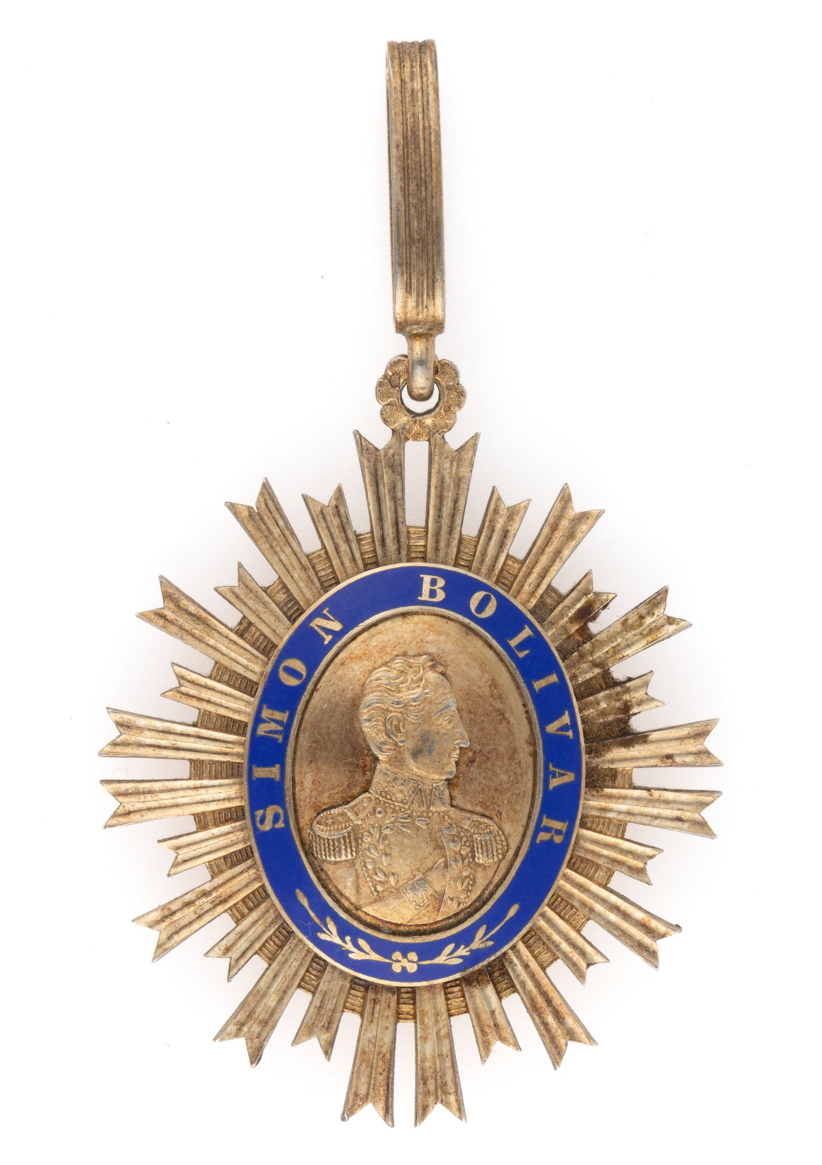 VENEZUELA "ORDER OF THE LIBERATOR" MEDAL: VENEZUELA "ORDER OF THE LIBERATOR" MEDAL, enamel and silver-gilt of unknown fineness, the central ovate reserve with a bust-length depiction of Simon Bolivar surrounded by a blue band letter