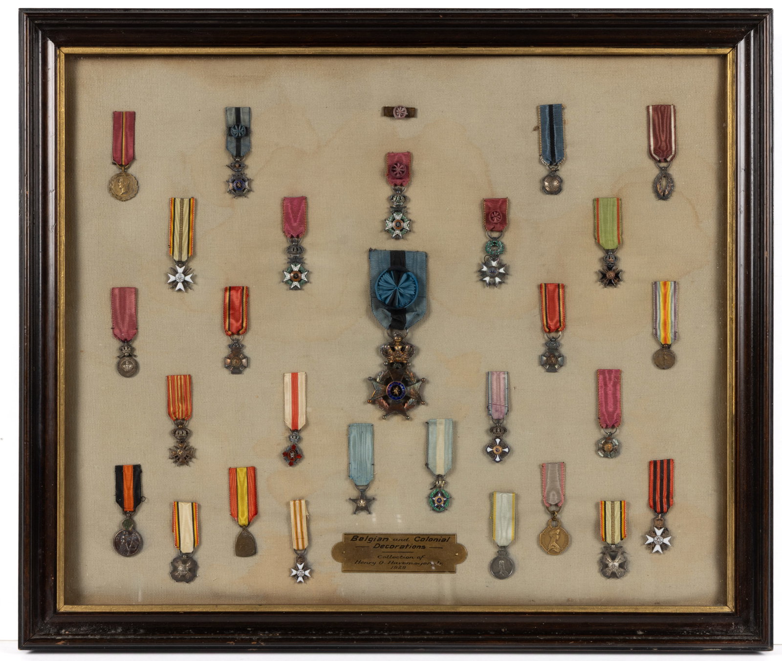 BELGIAN AND COLONIAL DECORATIONS / BADGES / MEDALS WITH HENRY HAVEMEYER ASSOCIATION, FRAMED LOT OF: BELGIAN AND COLONIAL DECORATIONS / BADGES / MEDALS WITH HENRY HAVEMEYER ASSOCIATION, FRAMED LOT OF 29, most silver or silver-gilt of unknown fineness, several bronze examples, and several with enamel 