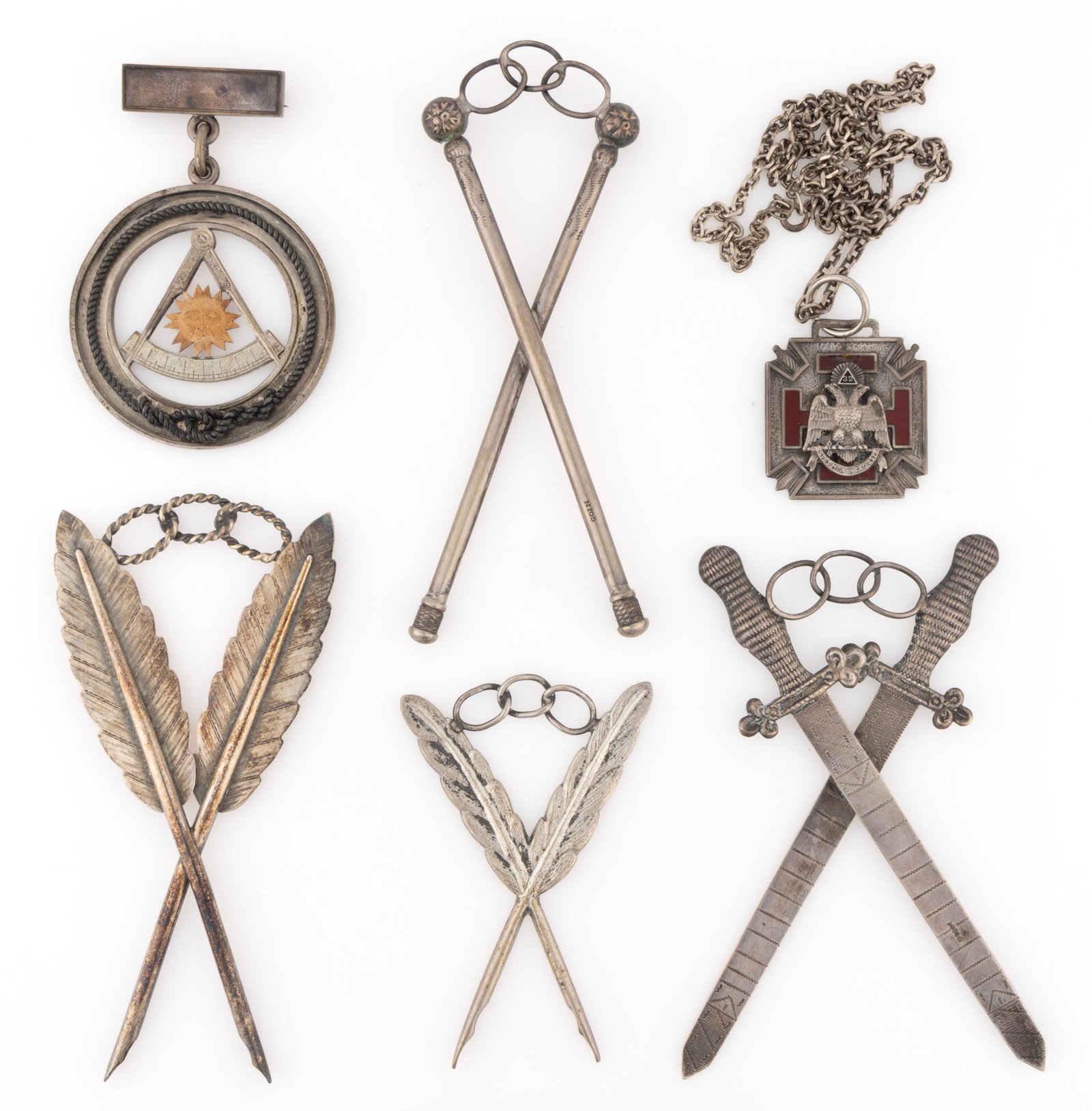 ASSORTED STERLING, COIN, AND OTHER SILVER ODD FELLOWS AND SOCIETY JEWELS, LOT OF SIX: ASSORTED STERLING, COIN, AND OTHER SILVER ODD FELLOWS AND SOCIETY JEWELS, LOT OF SIX, comprising a coin silver four-piece Odd Fellows group with each having a three-linked chain, which symbolizes frie