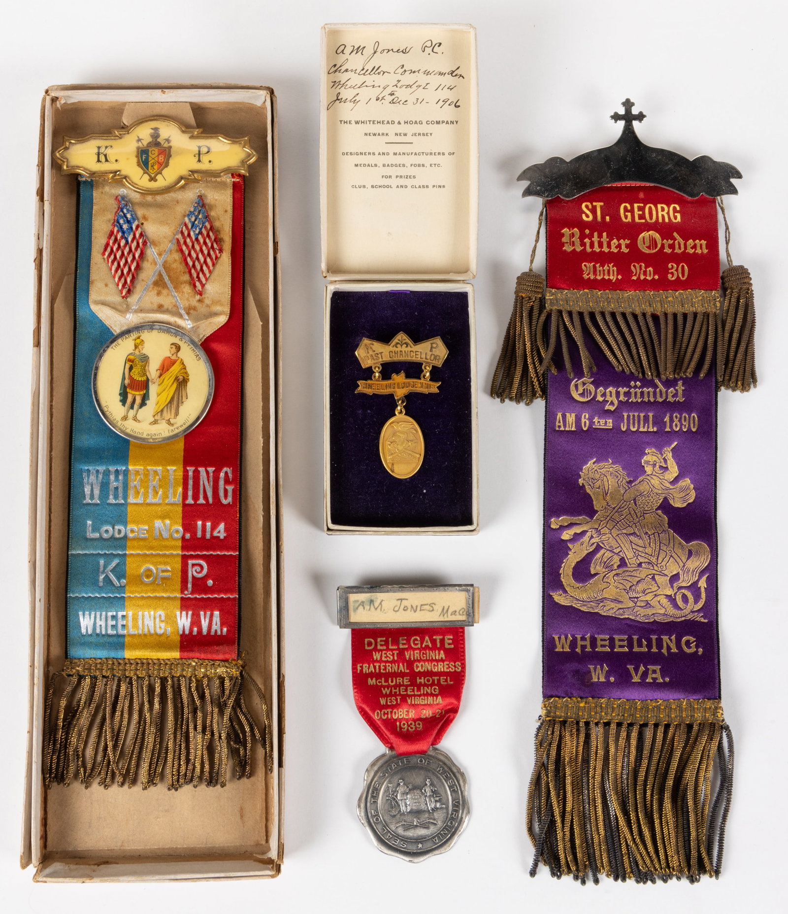 WHEELING, WEST VIRGINIA LODGE / FRATERNAL / SOCIETY BADGES / MEDALS / RIBBONS, LOT OF FOUR: WHEELING, WEST VIRGINIA LODGE / FRATERNAL / SOCIETY BADGES / MEDALS / RIBBONS, LOT OF FOUR, comprising two large ribbons, one Knights of Pythias example features a polychrome lithographed cellulo