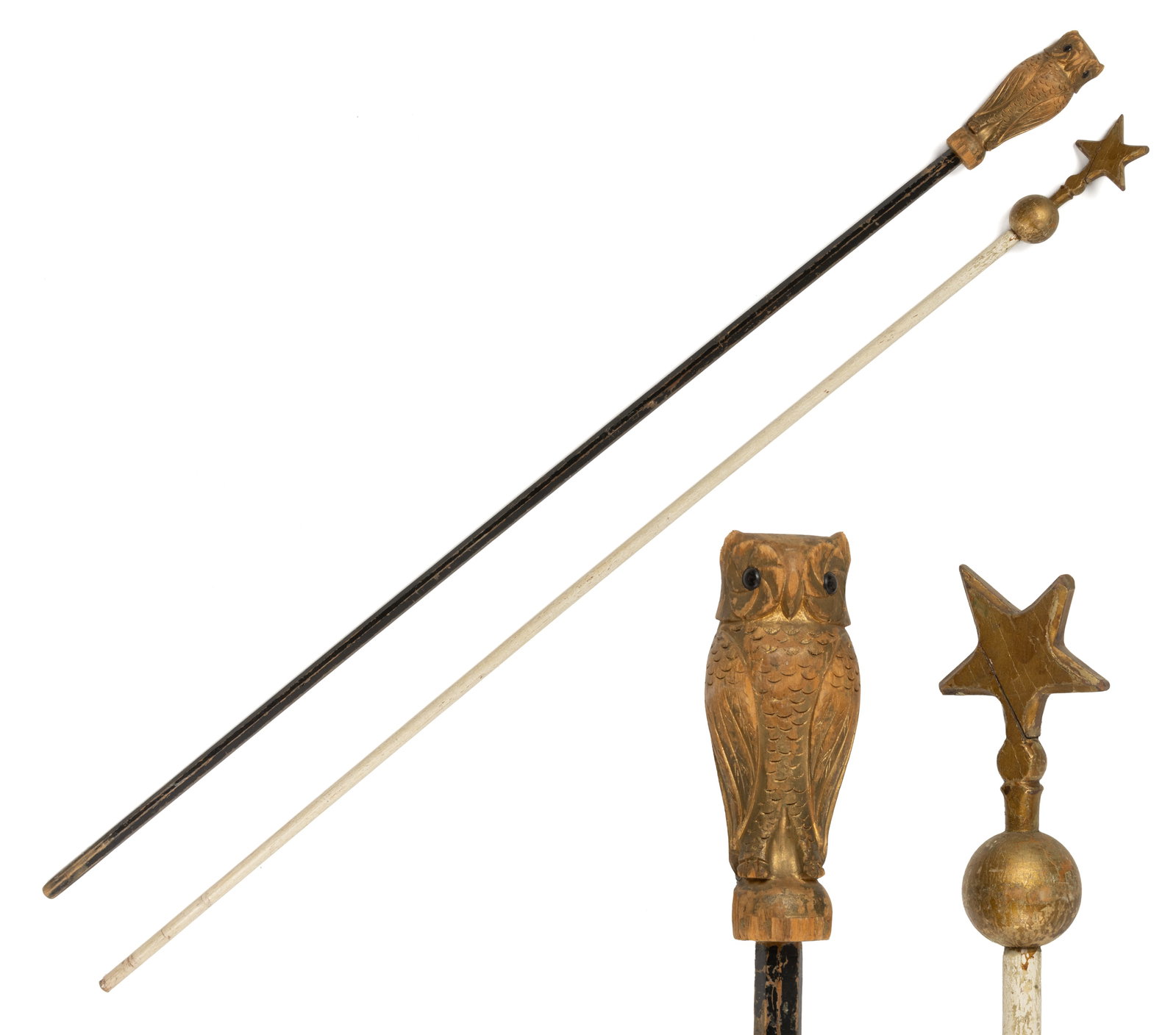 FOLK ART CARVED AND PAINTED LODGE STAFFS, LOT OF TWO: FOLK ART CARVED AND PAINTED LODGE STAFFS, LOT OF TWO, comprising an example with the figure of an owl at the top, the other with a star and ball finial, both mounted to long shafts. Both retain an ear