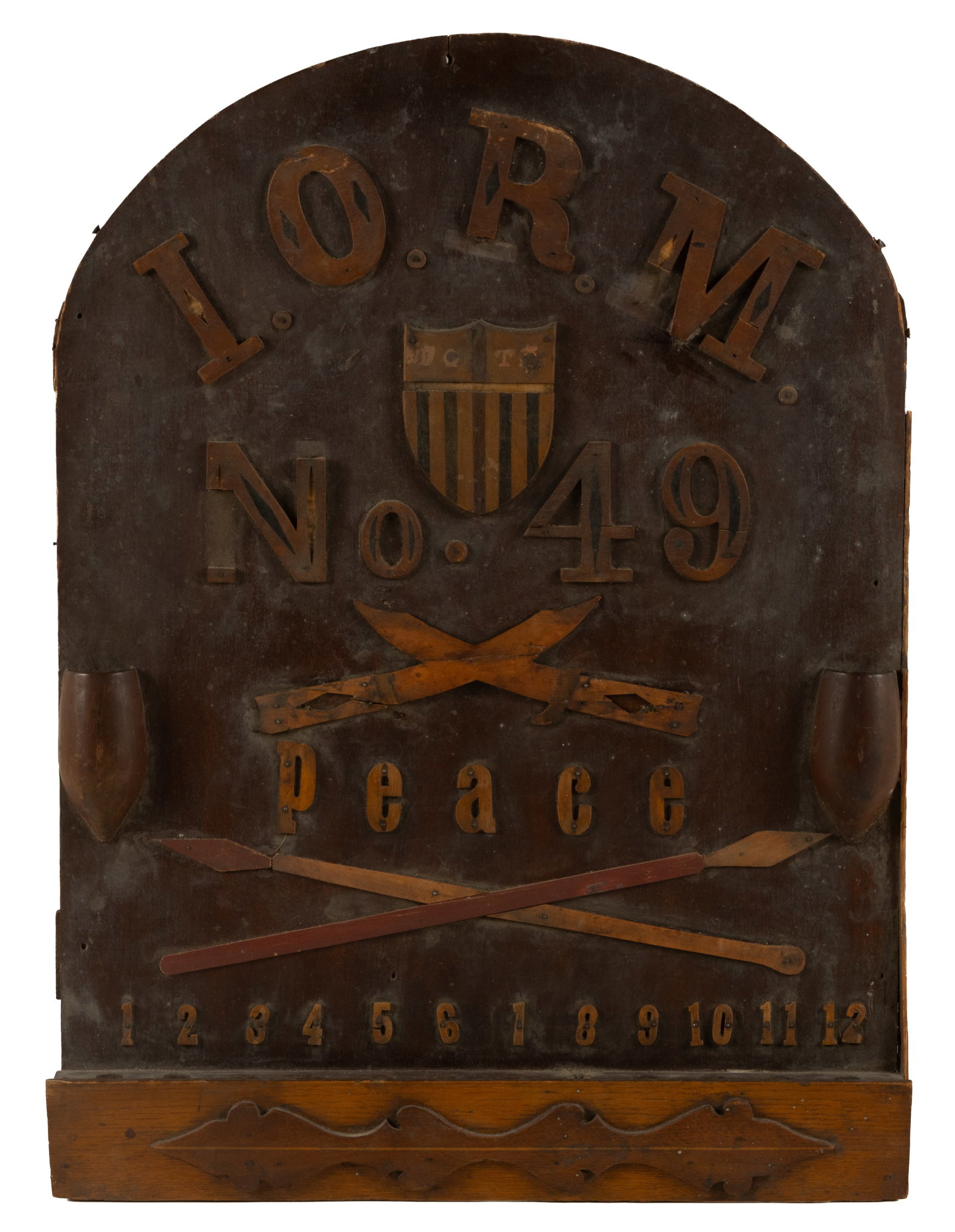 AMERICAN IMPROVED ORDER OF RED MEN CARVED WALL PLAQUE / REGISTER BOARD: AMERICAN IMPROVED ORDER OF RED MEN CARVED WALL PLAQUE / REGISTER BOARD, poplar, oak, walnut, and others, lettered "I. O. R. M. / No. 49 / Peace" with a numbered tracking row at the bottom ed