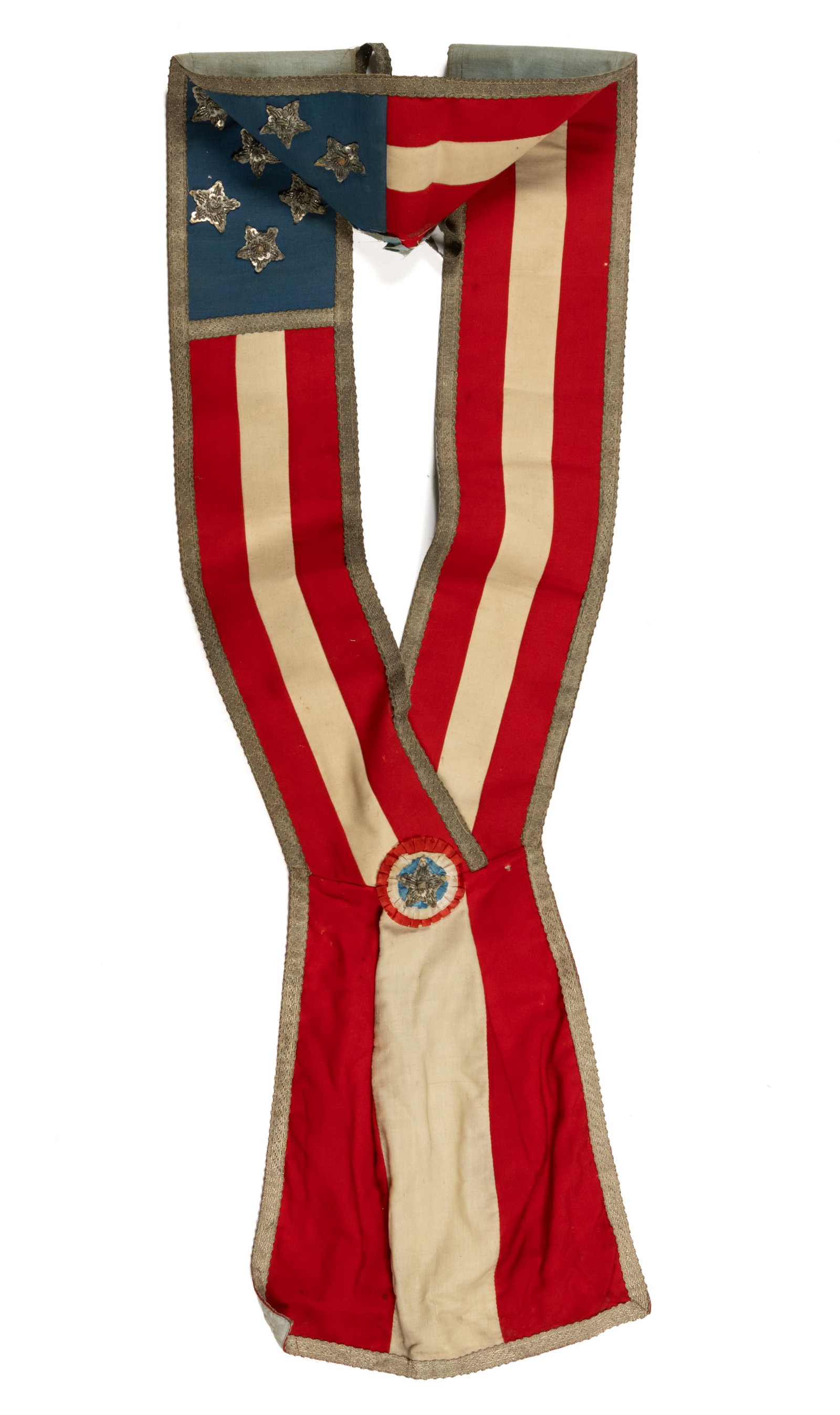 AMERICAN PATRIOTIC PARADE SASH: AMERICAN PATRIOTIC PARADE SASH, wool and cotton, featuring a blue canton area with stars having crinkled-wire and sequin decoration, the remainder with red and white stripes and a rosette where t