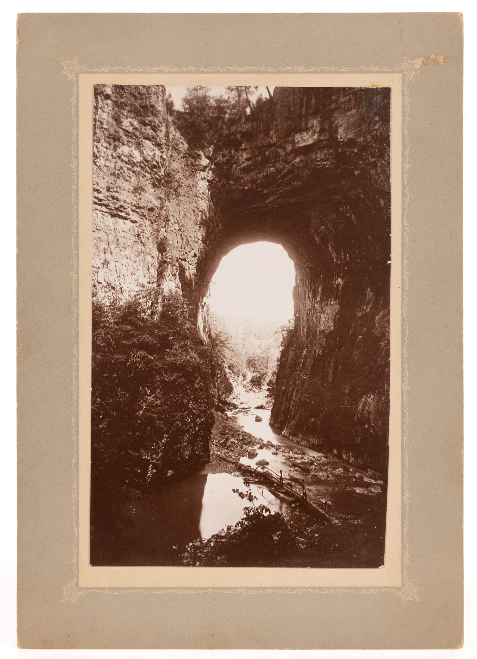 MICHAEL MILEY (LEXINGTON, VA, 1841-1918), ROCKBRIDGE CO., SHENANDOAH VALLEY OF VIRGINIA PHOTOGRAPH: MICHAEL MILEY (LEXINGTON, VA, 1841-1918), ROCKBRIDGE CO., SHENANDOAH VALLEY OF VIRGINIA PHOTOGRAPH OF NATURAL BRIDGE, albumen-print on board, depicting a view of Natural Bridge with two figures in he 