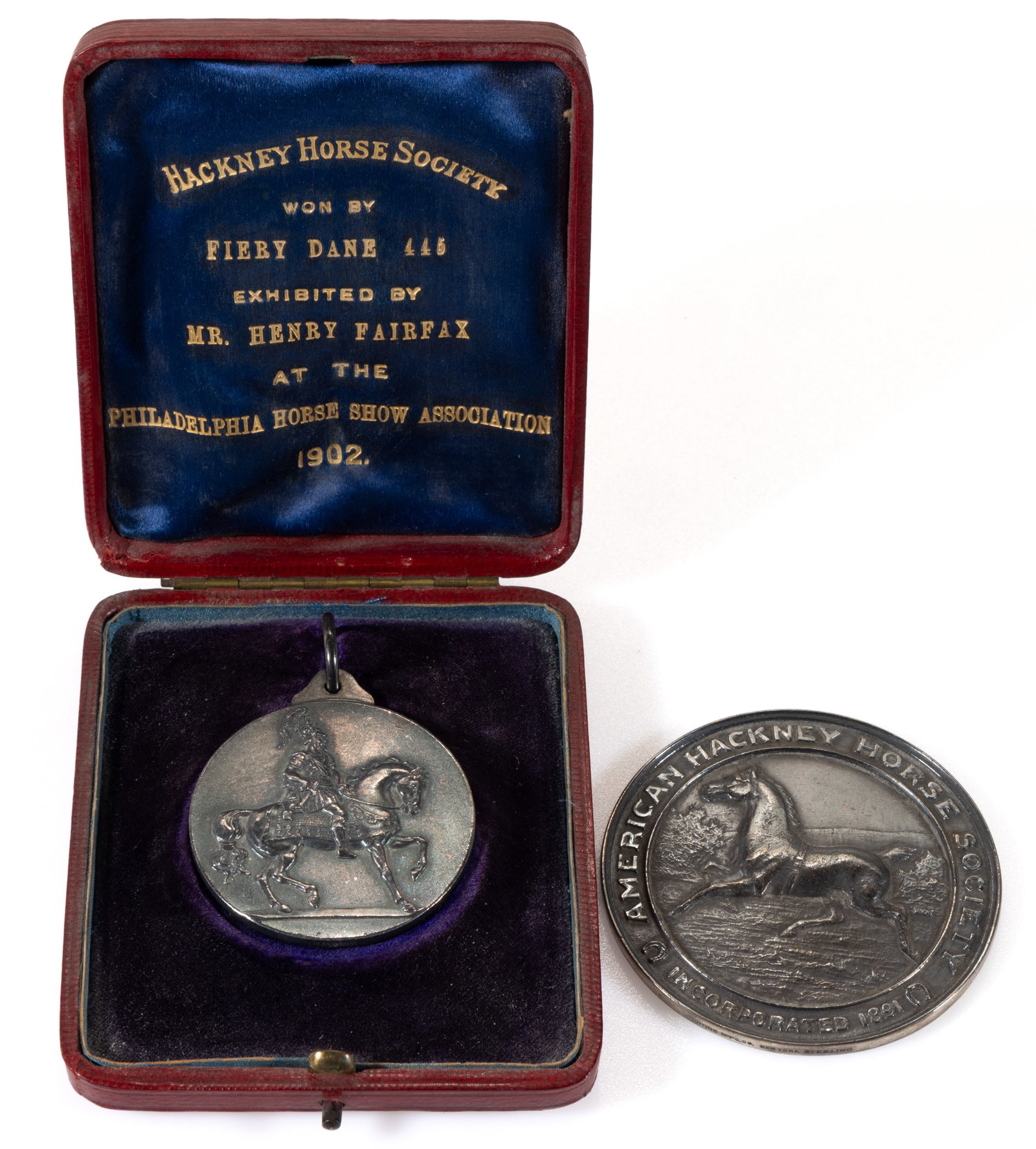 HENRY FAIRFAX, LOUDOUN CO., VIRGINIA ASSOCIATED HACKNEY HORSE SOCIETY SILVER MEDALS, LOT OF TWO: HENRY FAIRFAX, LOUDOUN CO., VIRGINIA ASSOCIATED HACKNEY HORSE SOCIETY SILVER MEDALS, LOT OF TWO, comprising a smaller example in its original fitted case which is inscribed "HACKNEY HORSE SO