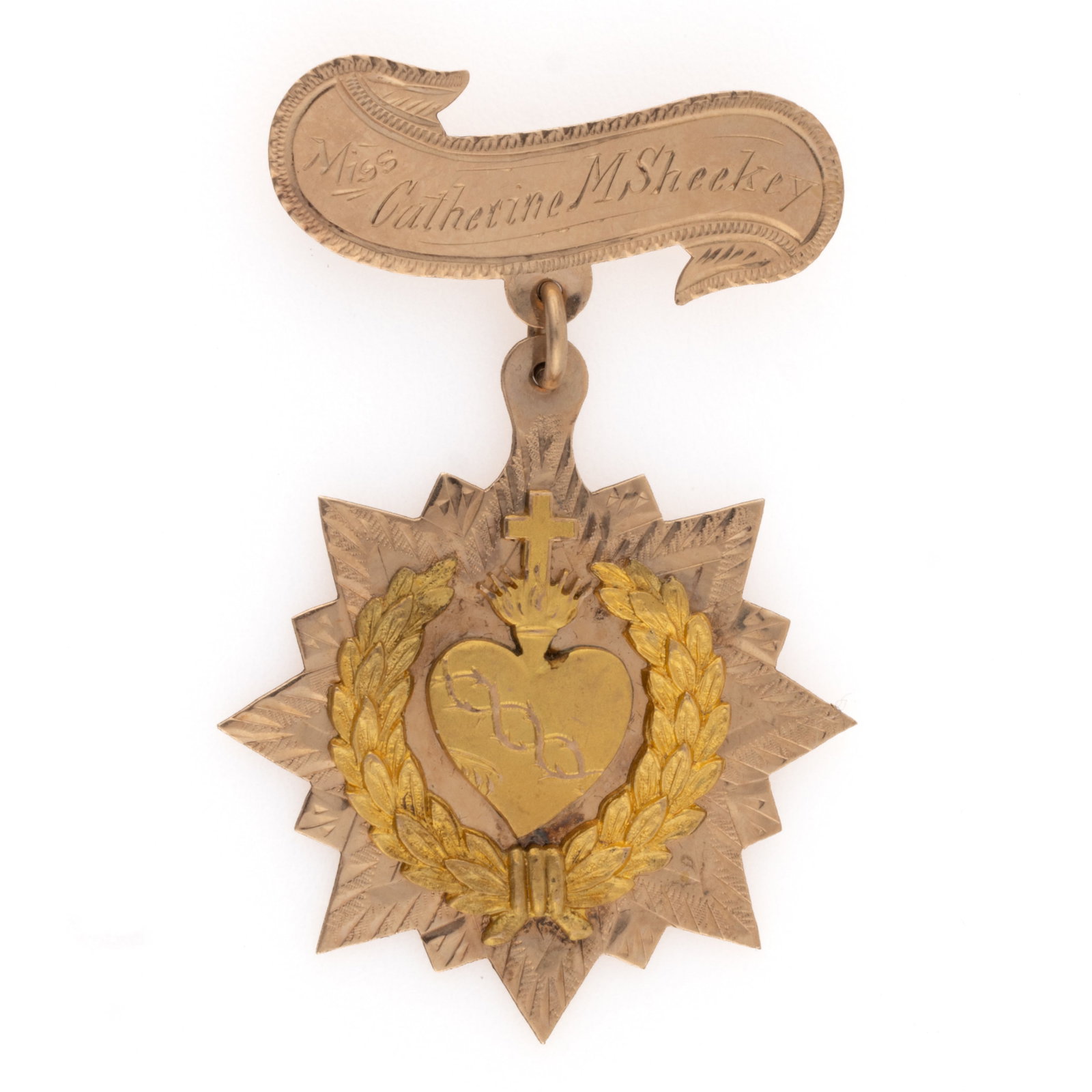 ST. JOSEPH'S ACADEMY, WHEELING, WEST VIRGINIA GOLD DEVOTIONAL MEDAL: ST. JOSEPH'S ACADEMY, WHEELING, WEST VIRGINIA GOLD DEVOTIONAL MEDAL, the obverse featuring the Sacred Heart of Jesus named for "Miss Catherine M. Sheekey" on the top banner, and engraved