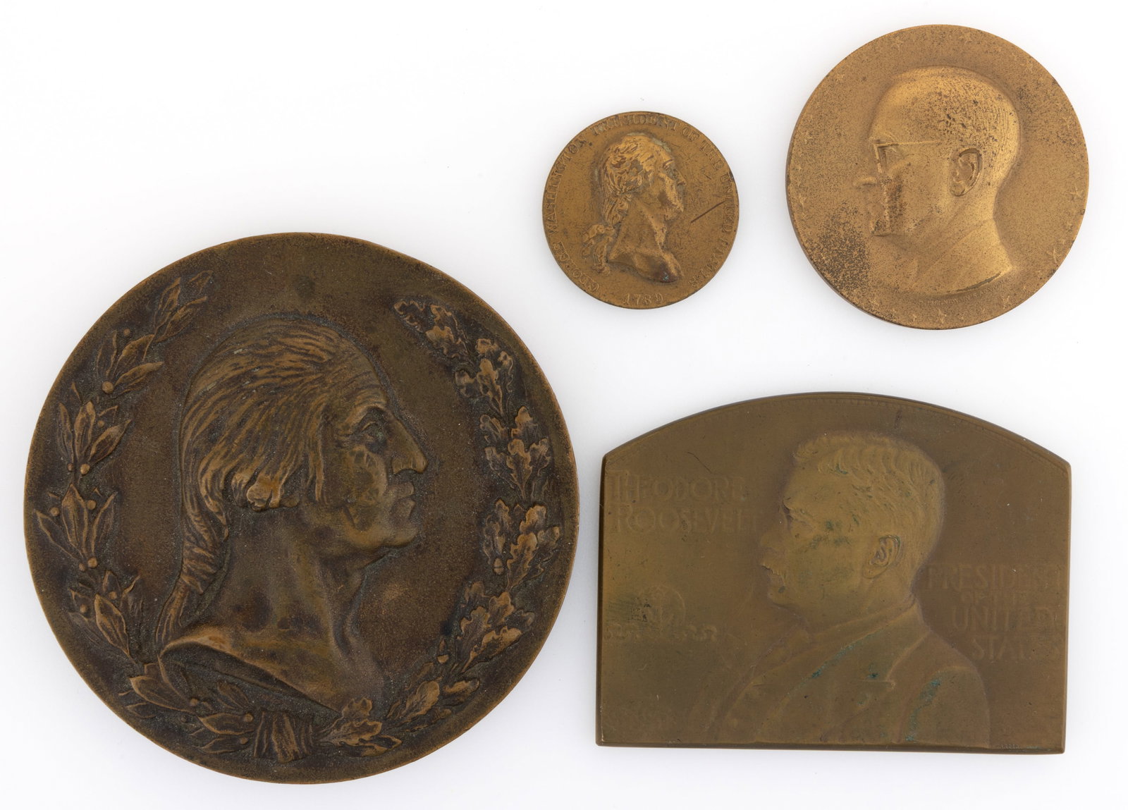 ASSORTED AMERICAN HISTORICAL / PRESIDENTIAL MEDALS, LOT OF FOUR: ASSORTED AMERICAN HISTORICAL / PRESIDENTIAL MEDALS, LOT OF FOUR, comprising a small example featuring George Washington resembling a peace token but with the reverse having a laurel wreath surrounding