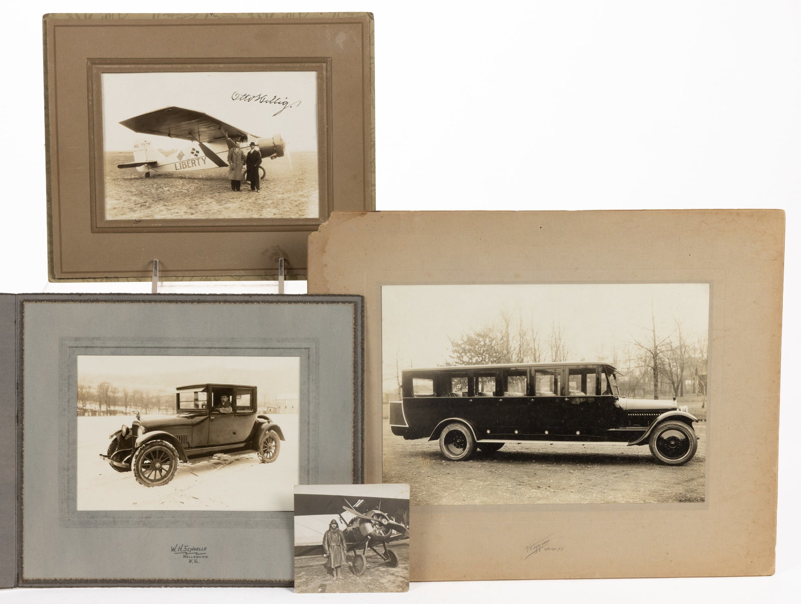 ANTIQUE / VINTAGE TRANSPORTATION PHOTOS, LOT OF FOUR: ANTIQUE / VINTAGE TRANSPORTATION PHOTOS, LOT OF FOUR, three on board, comprising an image of Liberty, the Bellanca J-300 monoplane with pilot Holger Hoiriis and passenger Otto Hillig, signed by Hillig