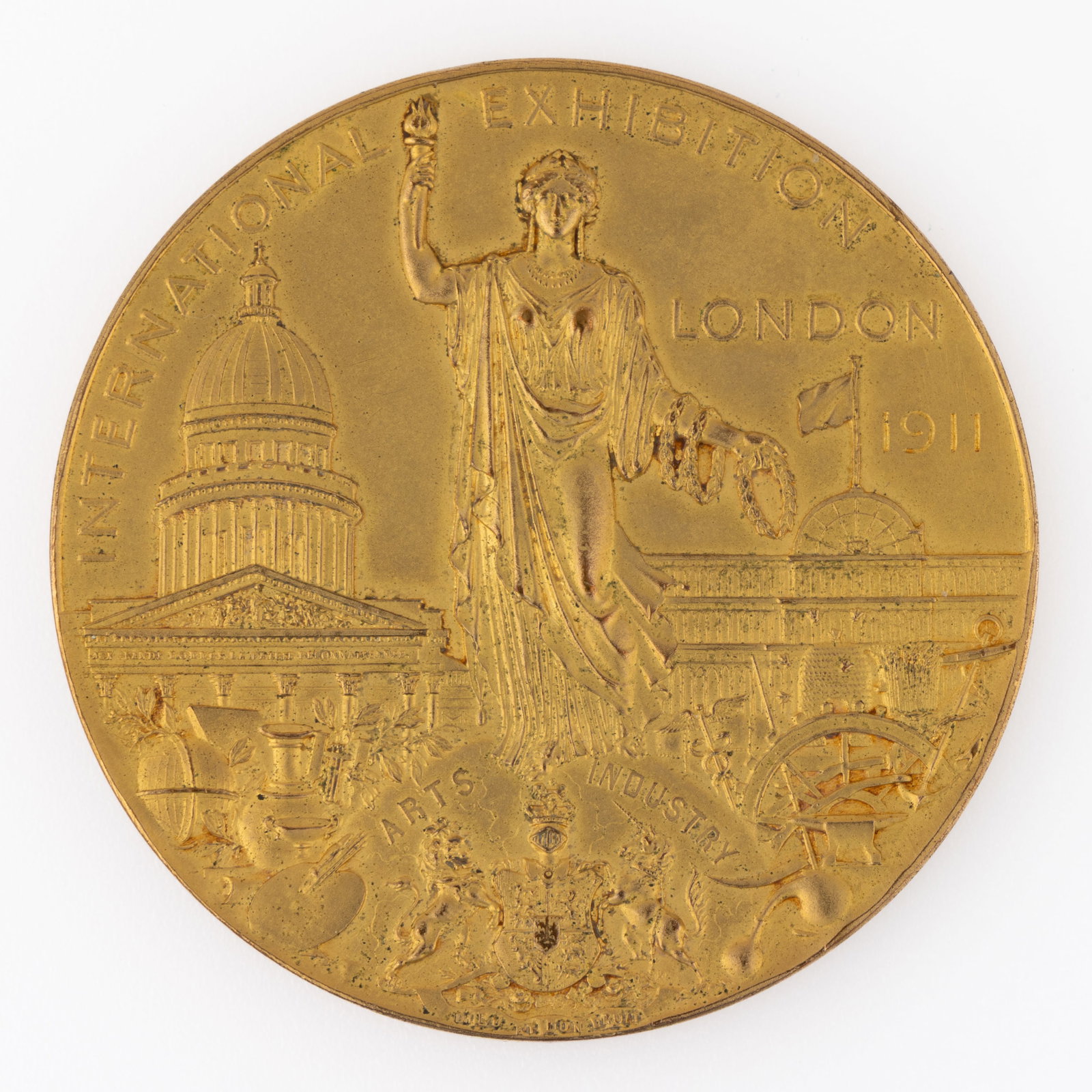 1911 LONDON INTERNATIONAL EXHIBITION BRONZE MEDAL: 1911 LONDON INTERNATIONAL EXHIBITION BRONZE MEDAL, gilt bronze, depicting Britannia standing with St. Paul's Cathedral on her left and the crystal palace on her right, the reverse showing an alleg