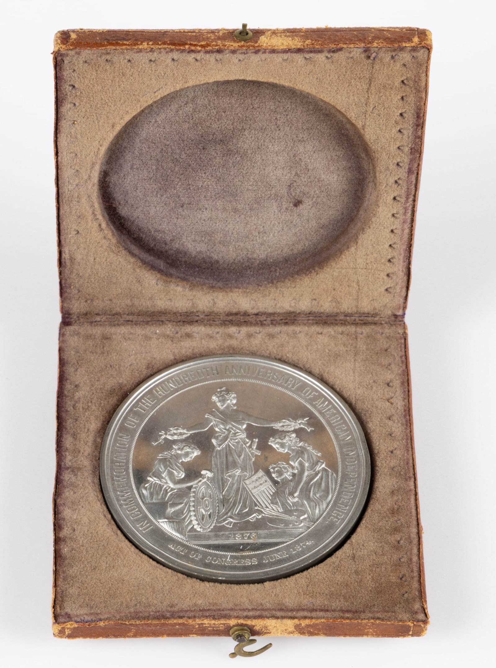 1876 PHILADELPHIA EXPOSITION CENTENNIAL / HUNDREDTH ANNIVERSARY OF AMERICAN INDEPENDENCE MEDAL: 1876 PHILADELPHIA EXPOSITION CENTENNIAL / HUNDREDTH ANNIVERSARY OF AMERICAN INDEPENDENCE MEDAL, silver-like white metal, obverse featuring Lady Liberty crowning figures of Art and Industry and lettere