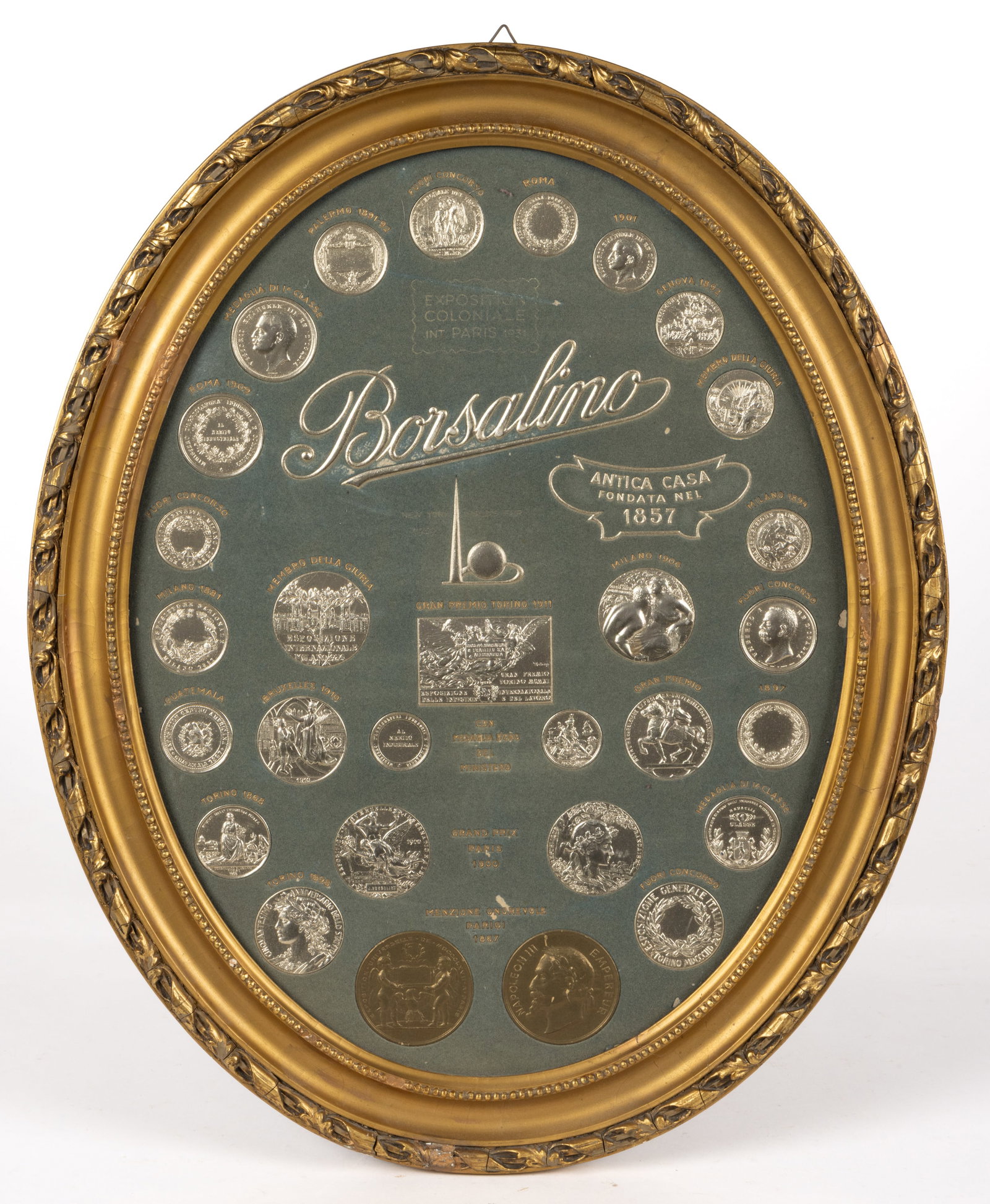 BORSALINO HATS EXPOSITION / WORLD'S FAIR ADVERTISING SIGN: BORSALINO HATS EXPOSITION / WORLD'S FAIR ADVERTISING SIGN, heavy molded/stamped pasteboard with gilt and silver patina, an unusual hanging display featuring facsimiles of all the gold an
