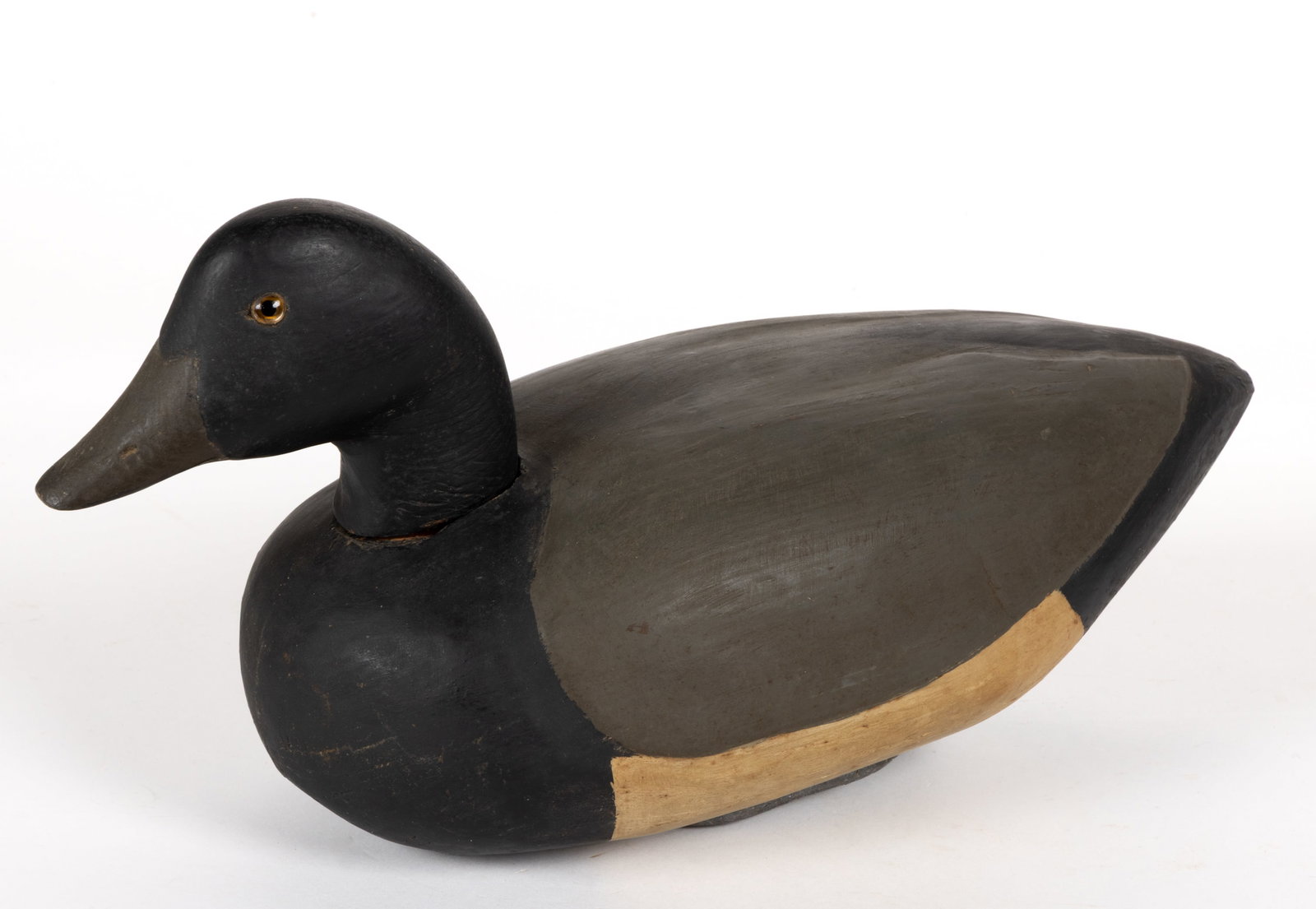 AMERICAN CARVED AND PAINTED SCAUP DECOY: AMERICAN CARVED AND PAINTED SCAUP DECOY, polychrome-painted, solid body, applied head and glass eyes, applied lead weight to underside of base. First half 20th century. 6 3/4" HOA, 13 1/2&qu