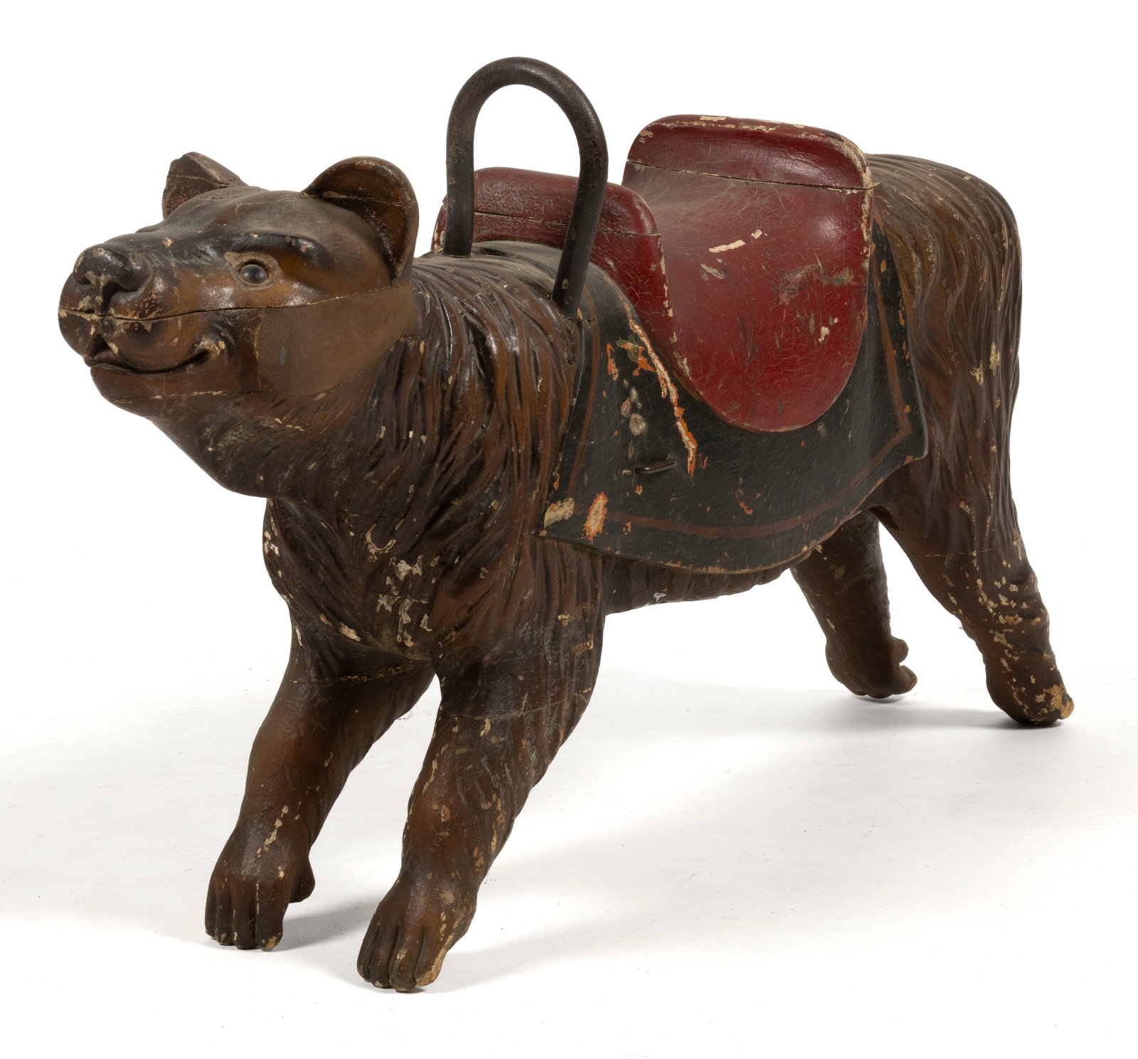FOLK ART CARVED AND PAINTED WOODEN CHILD'S CAROUSEL BEAR CUB FIGURE: FOLK ART CARVED AND PAINTED WOODEN CHILD'S CAROUSEL BEAR CUB FIGURE, retaining likely original iron handle bar and an early polychrome surface. First half 20th century. 21" HOA, 40" LOA.