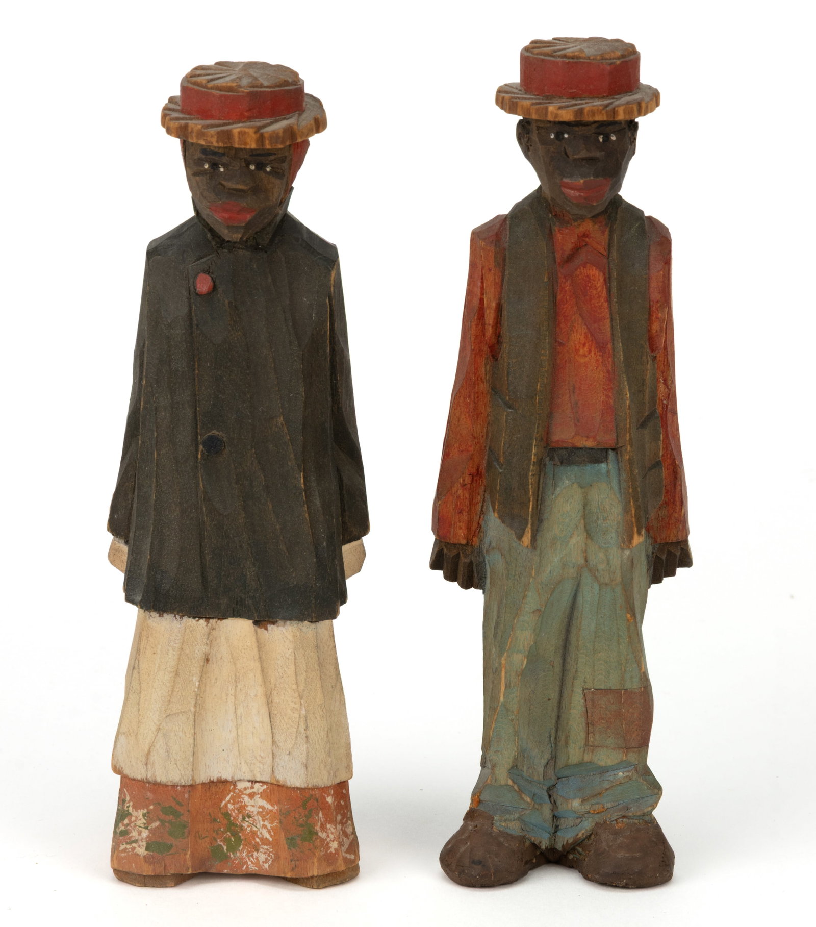ADRIAN R. WOODALL (MISSOURI / FLORIDA, 1888-1969) SOUTHERN BLACK AMERICANA FOLK ART CARVED AND: ADRIAN R. WOODALL (MISSOURI / FLORIDA, 1888-1969) SOUTHERN BLACK AMERICANA FOLK ART CARVED AND PAINTED FIGURES, PAIR, carved of solid softwood, depicting a man in a brimmed hat and a long jacket,