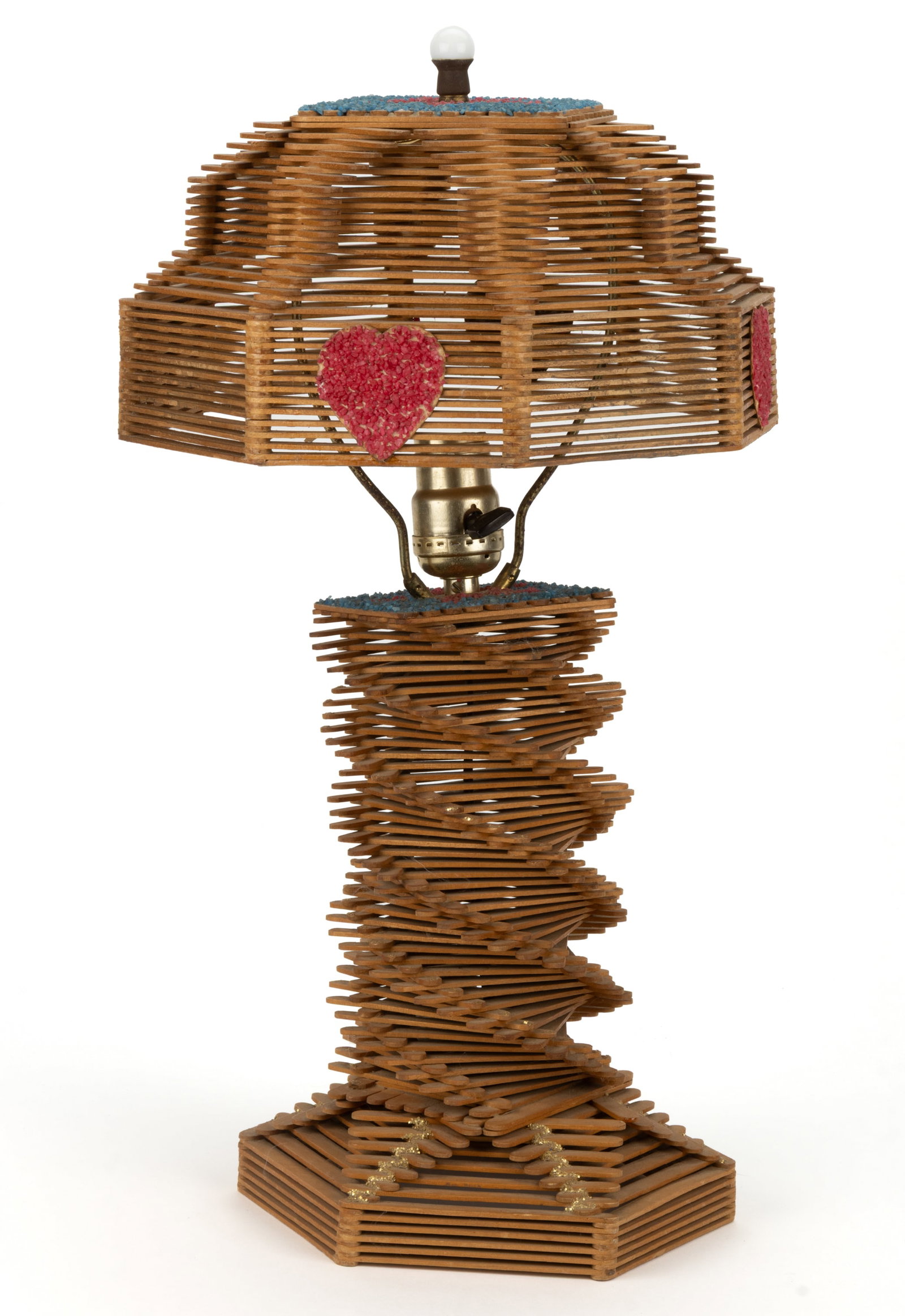 AMERICAN FOLK ART POPSICLE STICK LAMP: AMERICAN FOLK ART POPSICLE STICK LAMP, having a stepped domed shade and a swirled columnar base, having applied brightly-colored aquarium gravel decoration featuring stars and hearts. Retains original