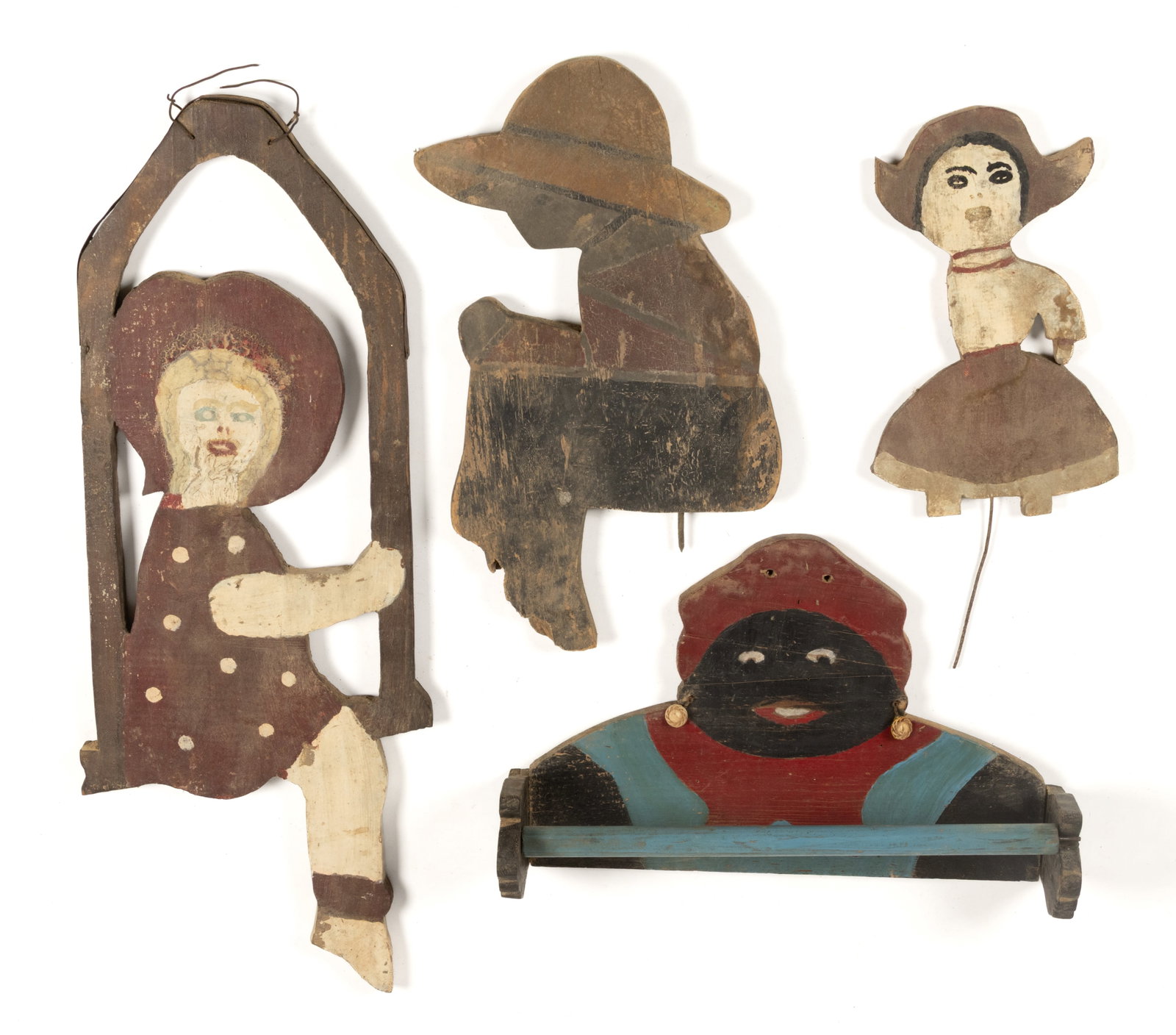 ASSORTED FOLK ART PAINTED FIGURAL PEOPLE CUT-OUT ORNAMENTS, LOT OF FOUR: ASSORTED FOLK ART PAINTED FIGURAL PEOPLE CUT-OUT ORNAMENTS, LOT OF FOUR, comprising a towel holder example depicting a Black Americana Mammy, fitted with a pair of earrings; a young girl with met