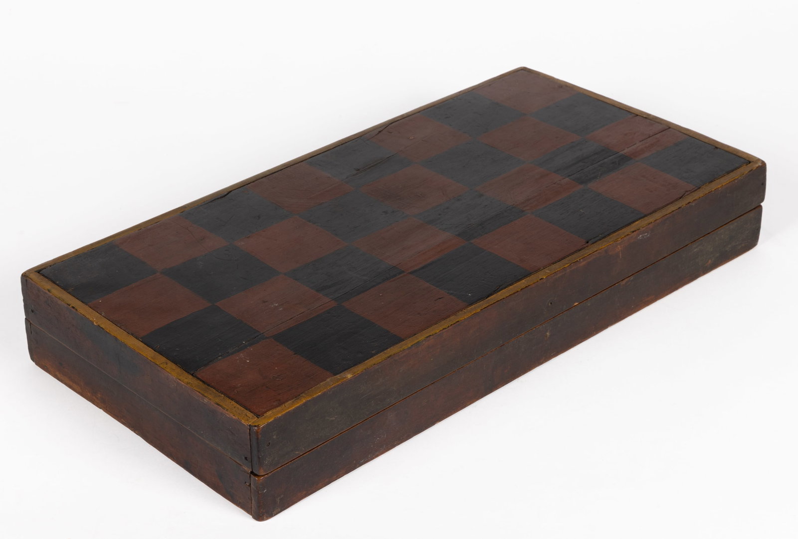 AMERICAN FOLK ART PAINTED WALNUT GAMEBOARD: AMERICAN FOLK ART PAINTED WALNUT GAMEBOARD, the hinged form with red-and-black checkerboard surface to the exterior, the interior a backgammon playing surface with applied paterae at center.