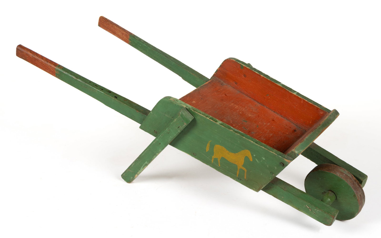 AMERICAN FOLK ART PAINTED PINE AND WALNUT CHILD'S TOY WHEELBARROW: AMERICAN FOLK ART PAINTED PINE AND WALNUT CHILD'S TOY WHEELBARROW, single solid wooden wheel, mustard yellow stenciled horse on each side, nailed construction. Retains original green- and red