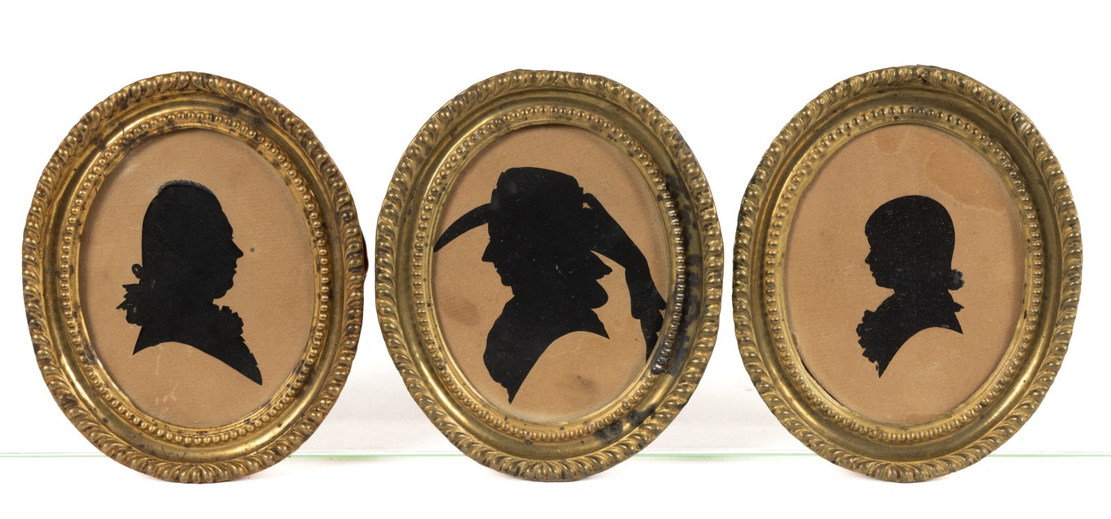 AMERICAN / BRITISH (19TH CENTURY) HOLLOW-CUT SILHOUETTES, LOT OF THREE: AMERICAN / BRITISH (19TH CENTURY) HOLLOW-CUT SILHOUETTES, LOT OF THREE, cut-paper, and pencil on paper, each bust-length, comprising a young girl facing left, identified verso as "daughter o