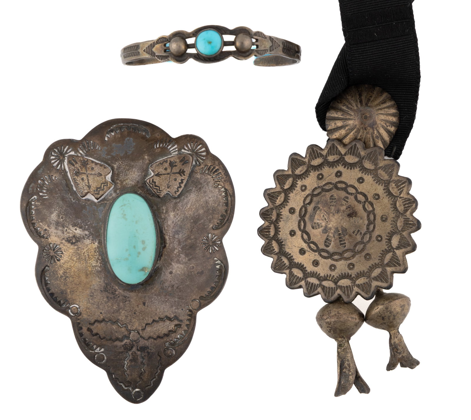 NATIVE AMERICAN / NAVAJO-STYLE SILVER JEWELRY, LOT OF THREE: NATIVE AMERICAN / NAVAJO-STYLE SILVER JEWELRY, LOT OF THREE, each piece having stamped decoration; comprising a medallion / button with two blossom drops and a button made from an 1893 Mexican coin, a