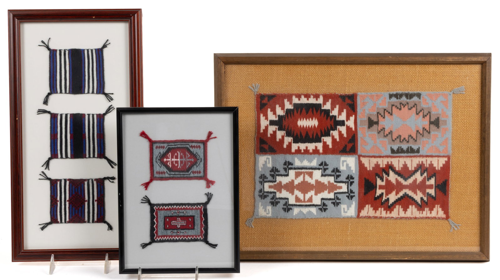 NATIVE AMERICAN NAVAJO WOOL MINIATURE RUGS, LOT OF SIX IN THREE FRAMES: NATIVE AMERICAN NAVAJO WOOL MINIATURE RUGS, LOT OF SIX IN THREE FRAMES, each housed under plexiglass in modern frames, comprising two rugs in a red, grey, black, and white color palette