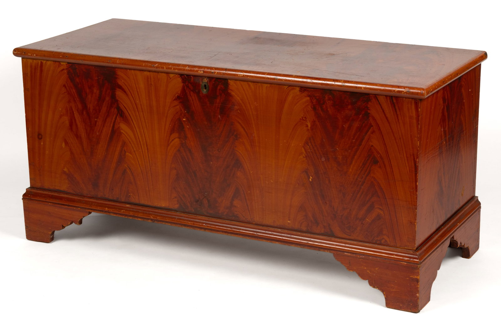 PENNSYLVANIA PAINT-DECORATED POPLAR BLANKET CHEST: PENNSYLVANIA PAINT-DECORATED POPLAR BLANKET CHEST, the rectangular top with applied edge molding over a dovetailed case with interior lidded till, the whole raised on an applied bracket-foot base. Ret