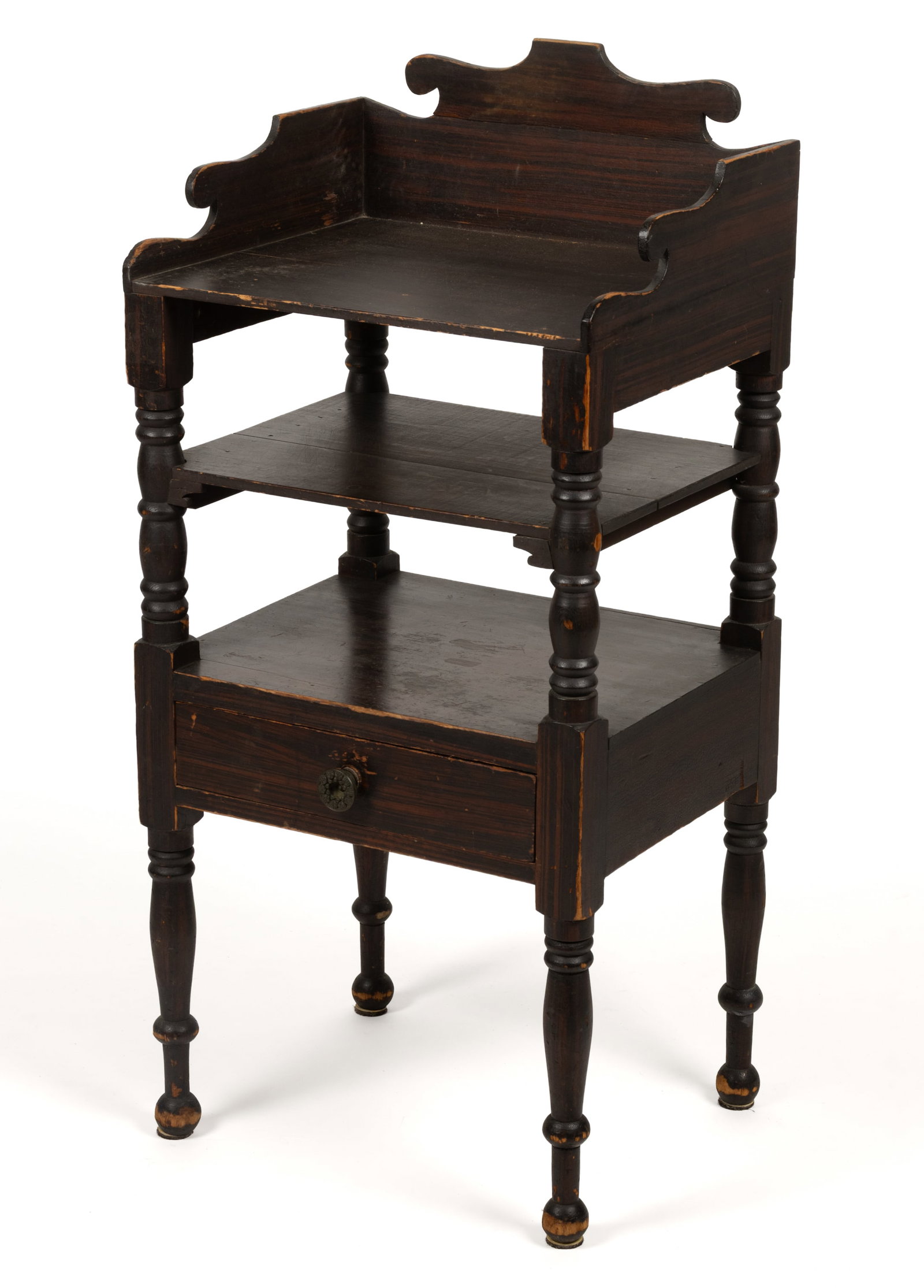 NEW ENGLAND PAINT-DECORATED PINE OPEN WASHSTAND: NEW ENGLAND PAINT-DECORATED PINE OPEN WASHSTAND, featuring a shaped gallery over a rectangular top, two medial shelves, and a drawer, the whole raised on turned legs. Retains the likely original 