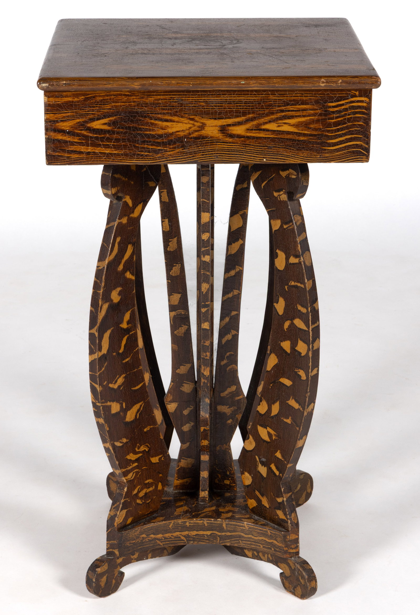 AMERICAN FOLK ART PAINT-DECORATED MIXED-WOOD STAND TABLE: AMERICAN FOLK ART PAINT-DECORATED MIXED-WOOD STAND TABLE, the unusual form with shaped base and supports, retaining possibly original whimsical surface in ocher and brown. Fourth quarter 19th/early