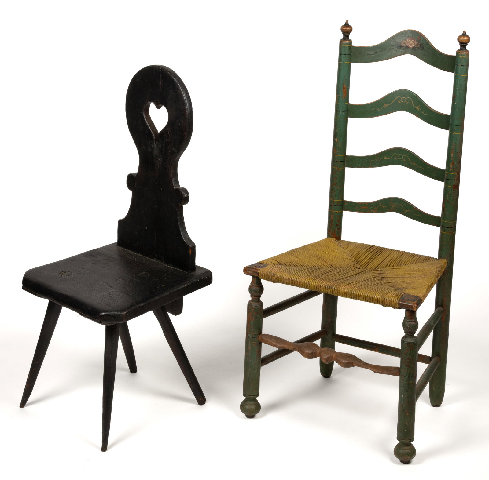 EUROPEAN OR AMERICAN PAINTED SIDE CHAIRS, LOT OF TWO: EUROPEAN OR AMERICAN PAINTED SIDE CHAIRS, LOT OF TWO, comprising a likely Moravian, possibly Pennsylvania, pine and oak brettstuhl or back stool with a cut-out shaped back having a heart piercing