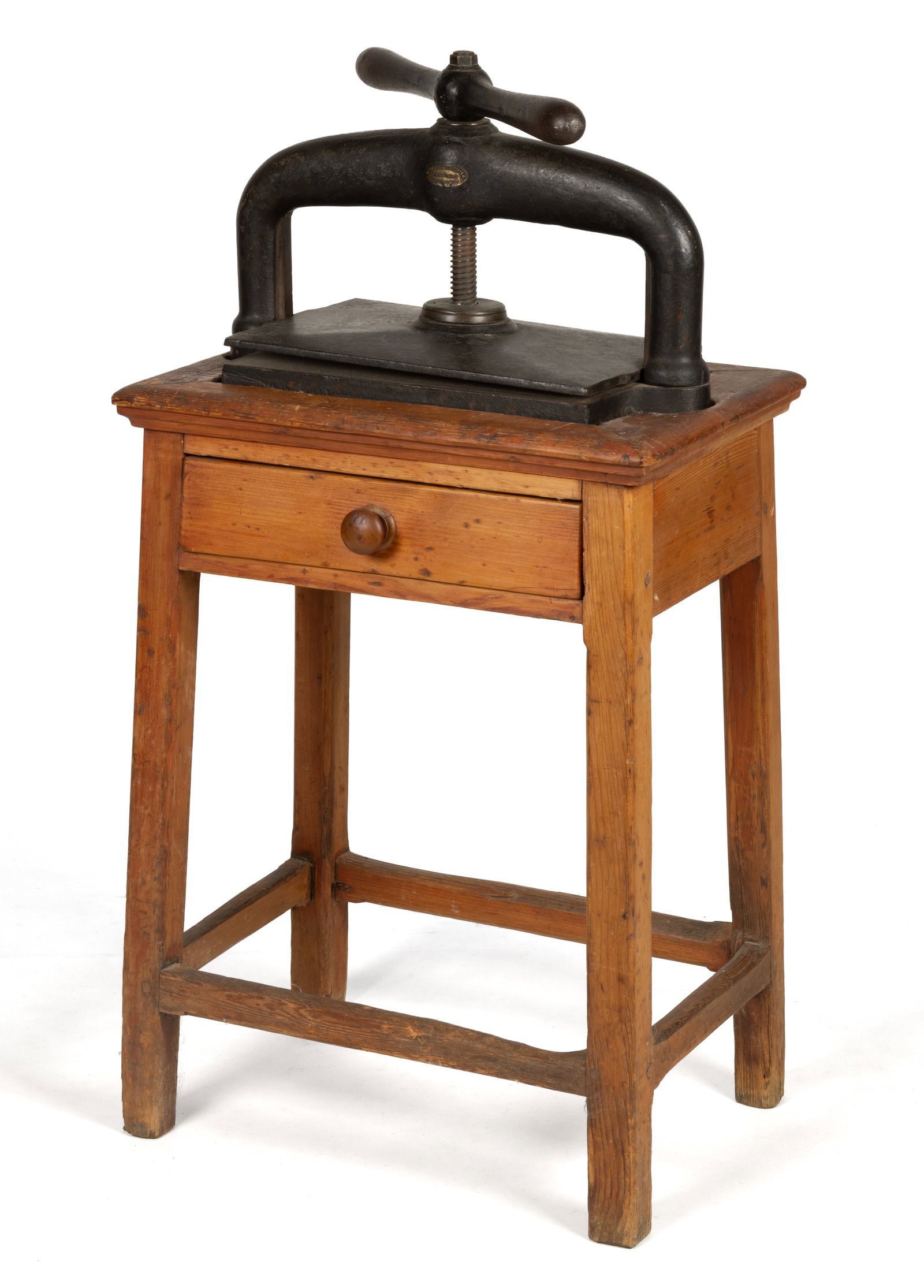 SCOTTISH CAST-IRON BOOK PRESS: SCOTTISH CAST-IRON BOOK PRESS, bearing brass manufacturer's tag marked "PATRICK RITCHIE / OAKFIELD / EDINBURGH", set on likely original pine stand with single drawer, splayed legs, and